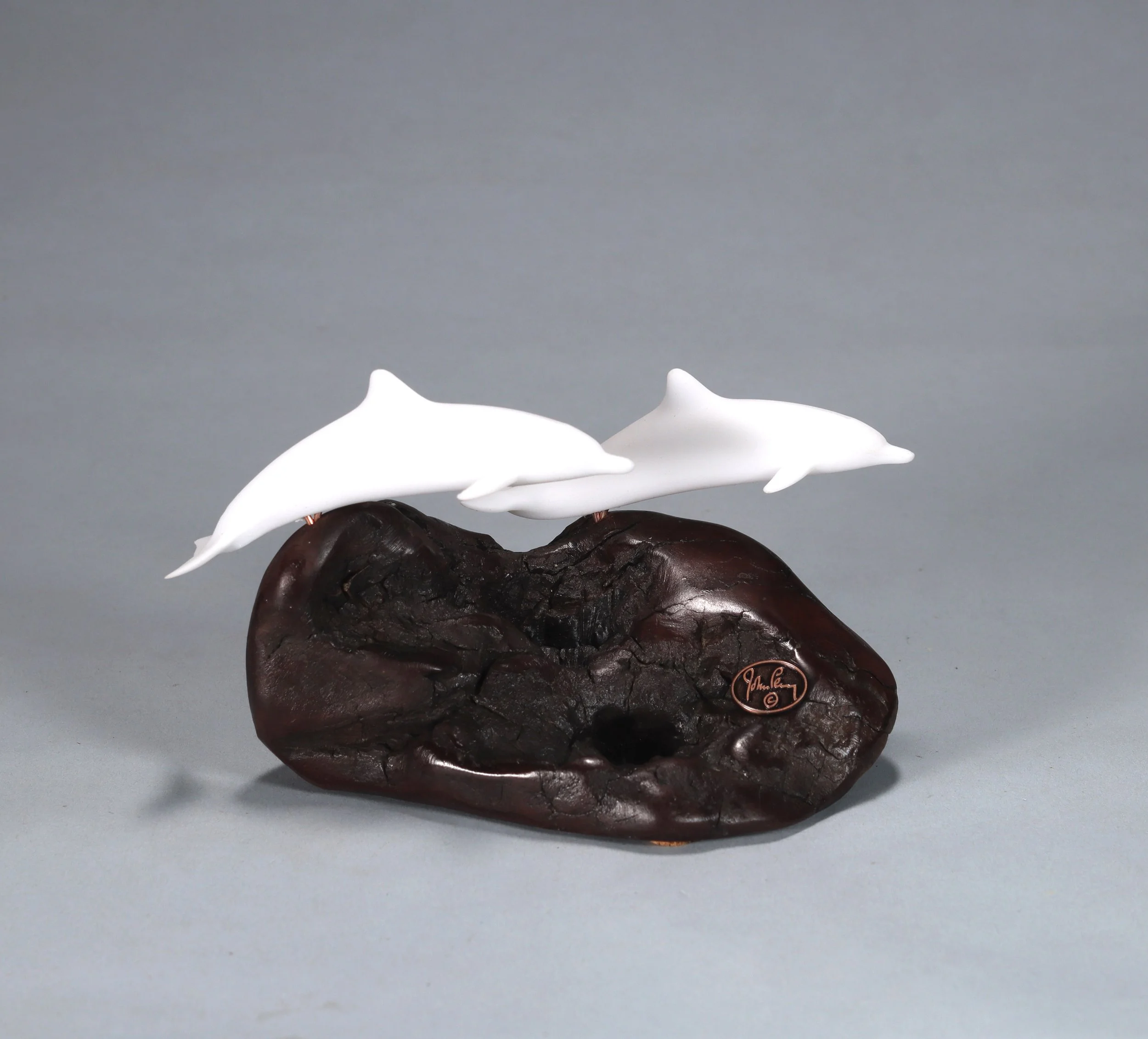 Dolphin Duo Sculpture 5in Long Pellucida on Polished Burlwood Base. Signed.
