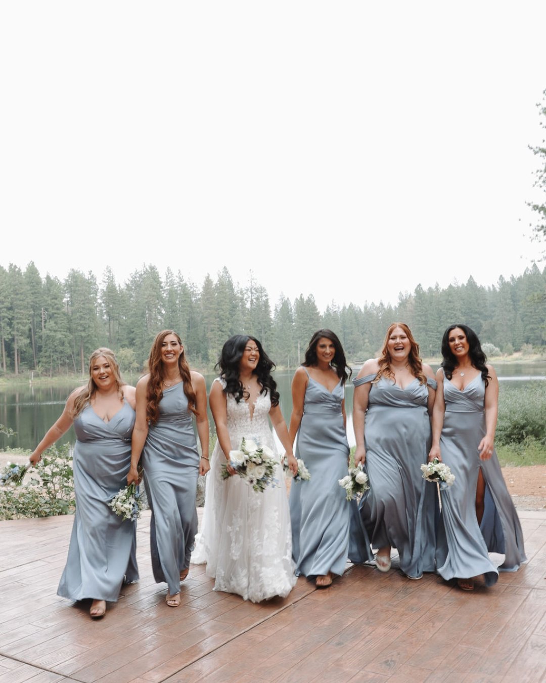 Obsessed with Tiffany's 'maids in blue! Their dusty satin gowns looked extra stunning on the overcast wedding day 🤍⁣
Photo: @reveriefilms.co⁣
Florals: @thefloralstudio.byjess