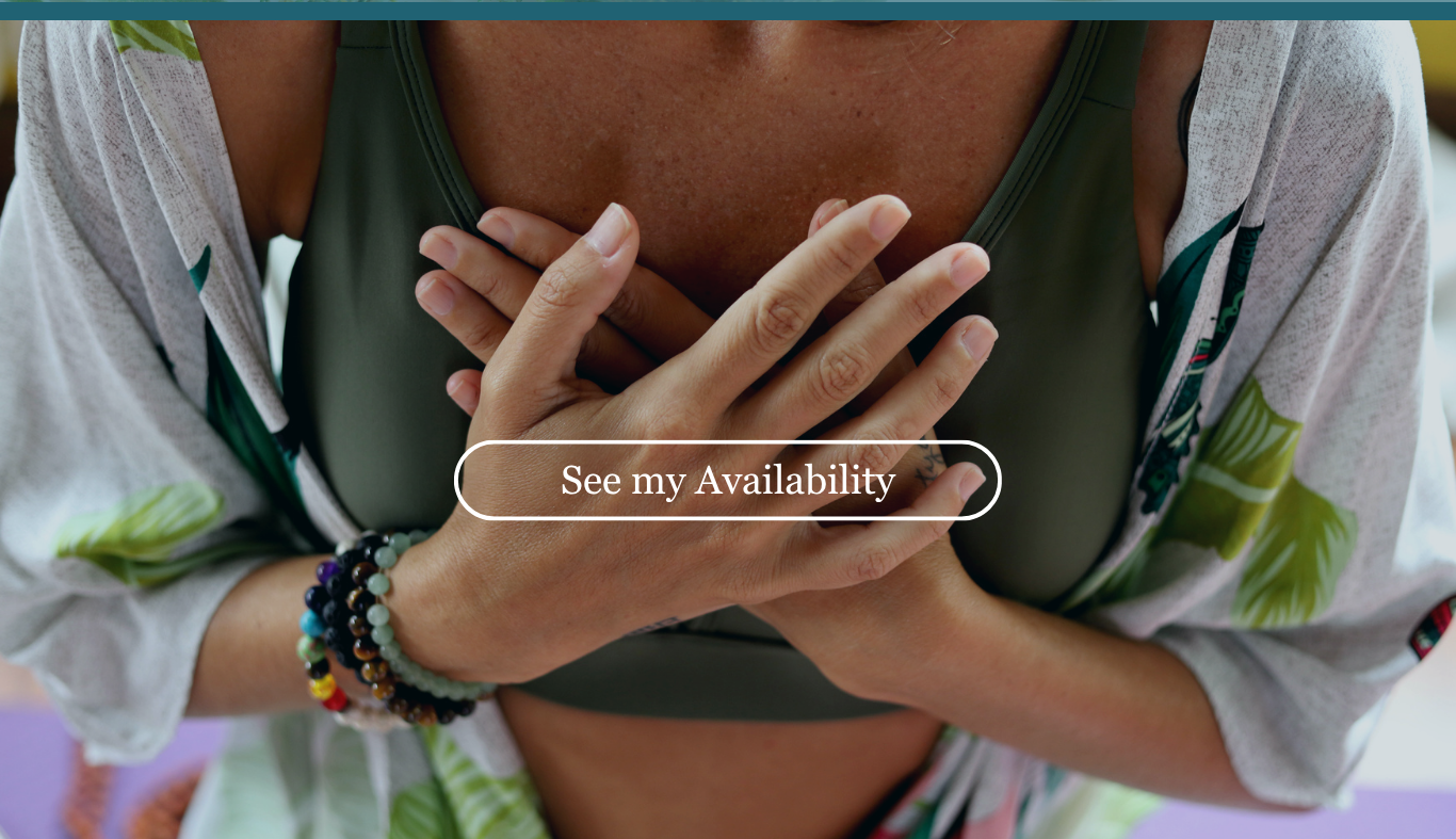 Person with crossed hands on chest, wearing multiple wristbands, wearing a green sports bra and a light cardigan with a leaf pattern, with a button that says "See my Availability".