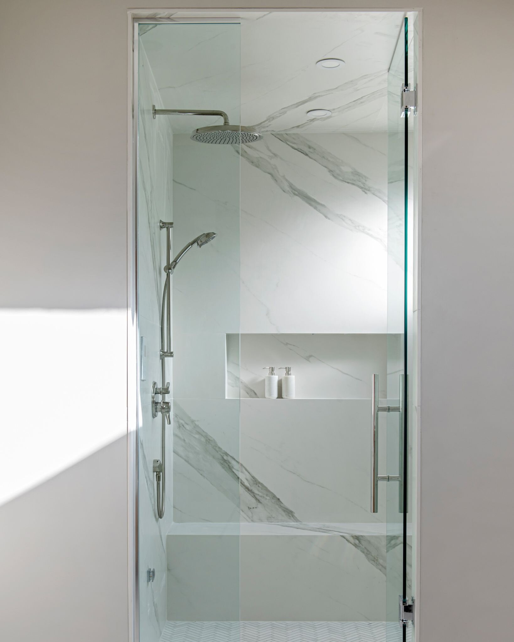 Ⓑ &mdash;CONTEMPORARY COMFORT
Indulge in the ultimate relaxation experience right in the comfort of your own home with a sleek and stylish steam shower. With its contemporary design featuring clean lines and timeless hardware, this luxurious addition