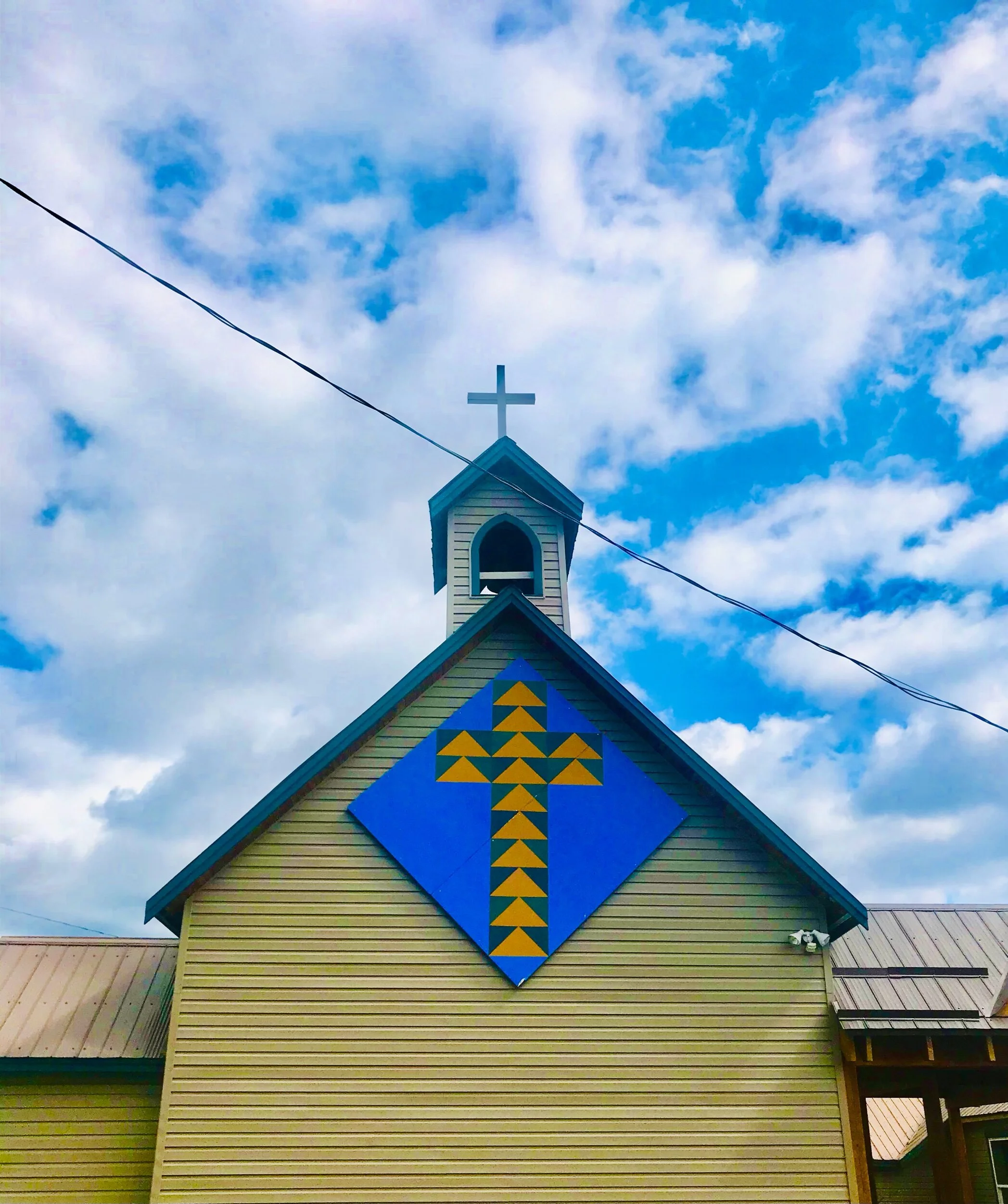 The Barn Quilt Trails “Flying Geese Cross” on the St.James Anglican Church Shuswap Adventure Girl