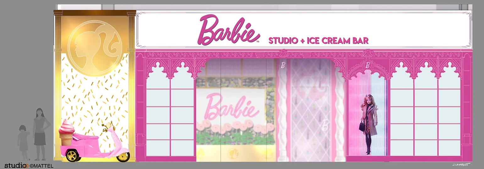 Front view of a Barbie-themed studio and ice cream bar storefront with a large pink sign, pink decorative architecture, a small pink ice cream cart with an ice cream cone on top, and a life-size Barbie doll figure in front. Studio O | JLD