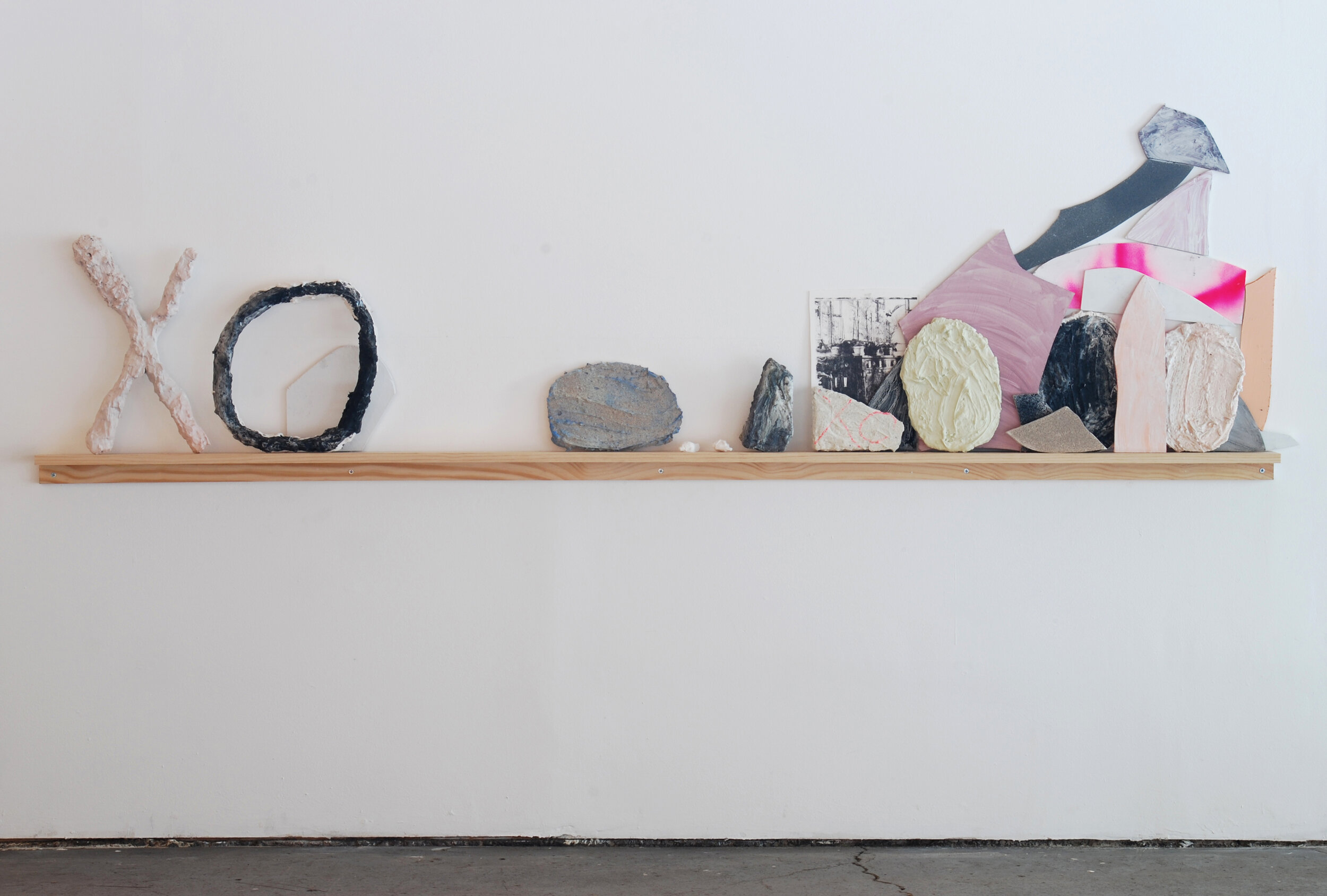   Pile (XO) , 2013 Cut and painted wood, foam, duct tape, plaster, celluclay, image transfer, plants, wood shelf Dimensions variable 