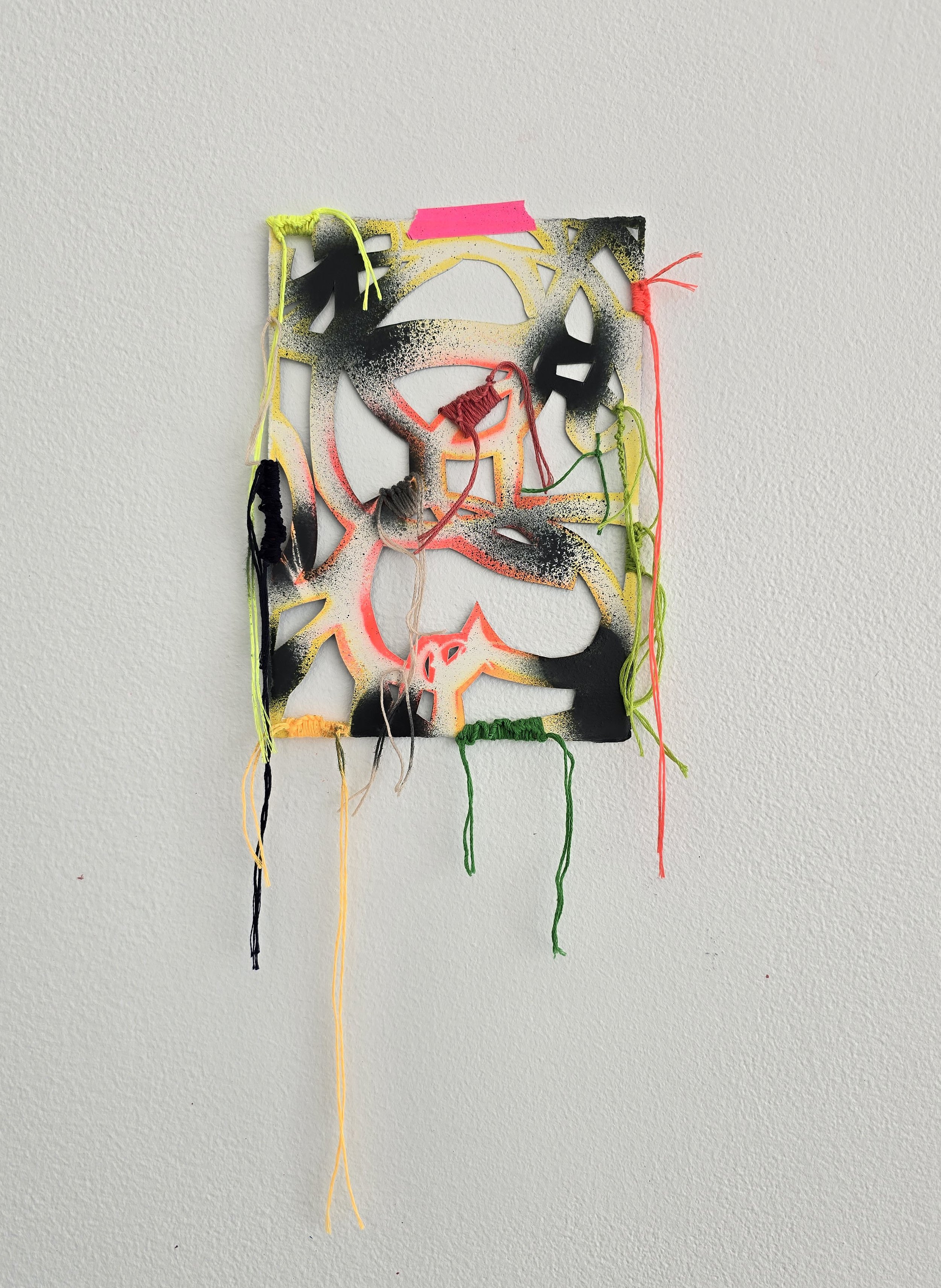 Wah-wah , 2025 Spray paint, woven embroidery floss, and artist’s tape on hand cut paper 16 × 7 inches