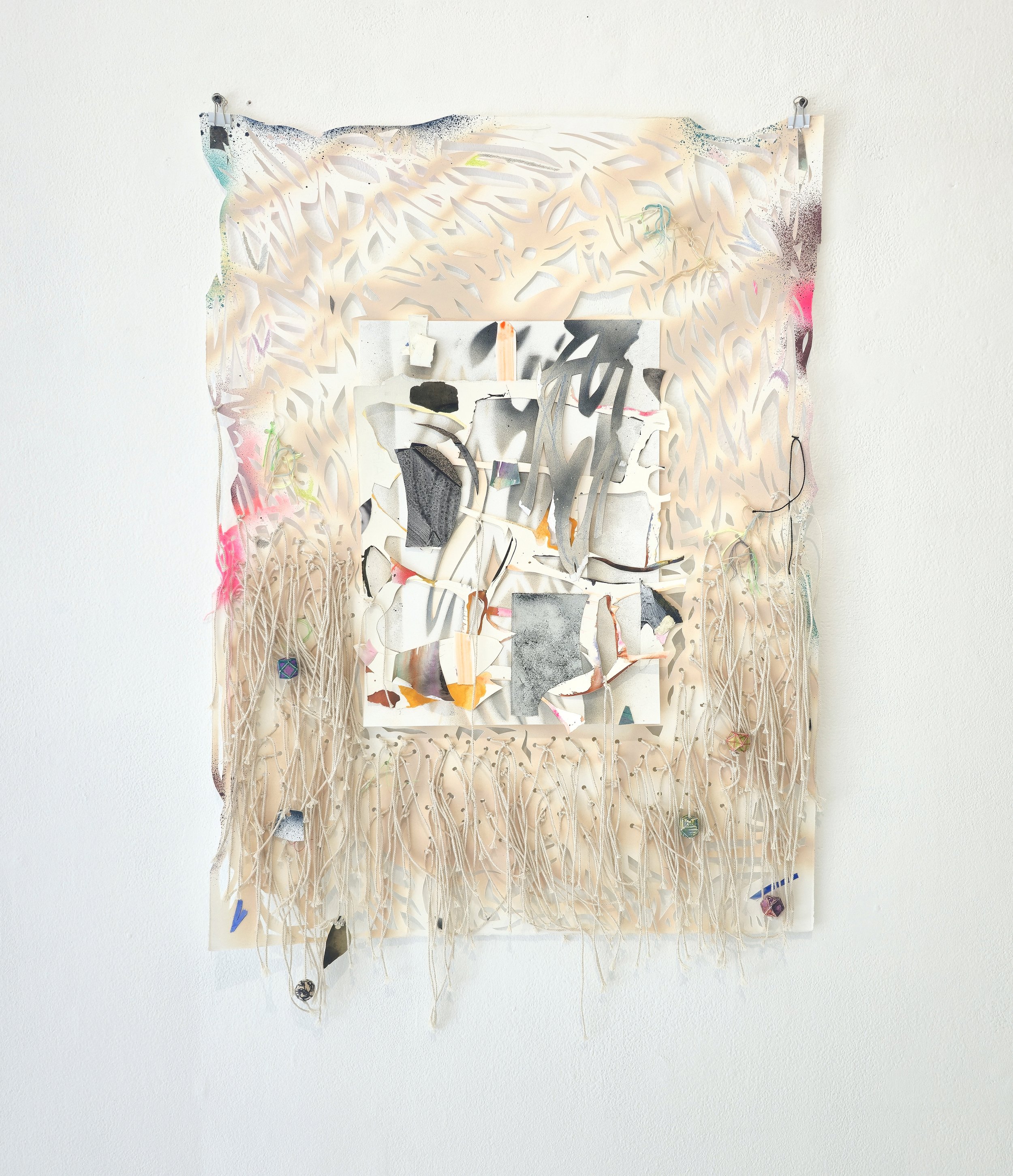   Game Night (God’s Dice) , 2025 Spray paint, gouache, acrylic, flashe, graphite powder, colored pencil, string, embroidery floss, Sharpie and wooded beads on hand cut and collaged paper 33 x 22 inches 