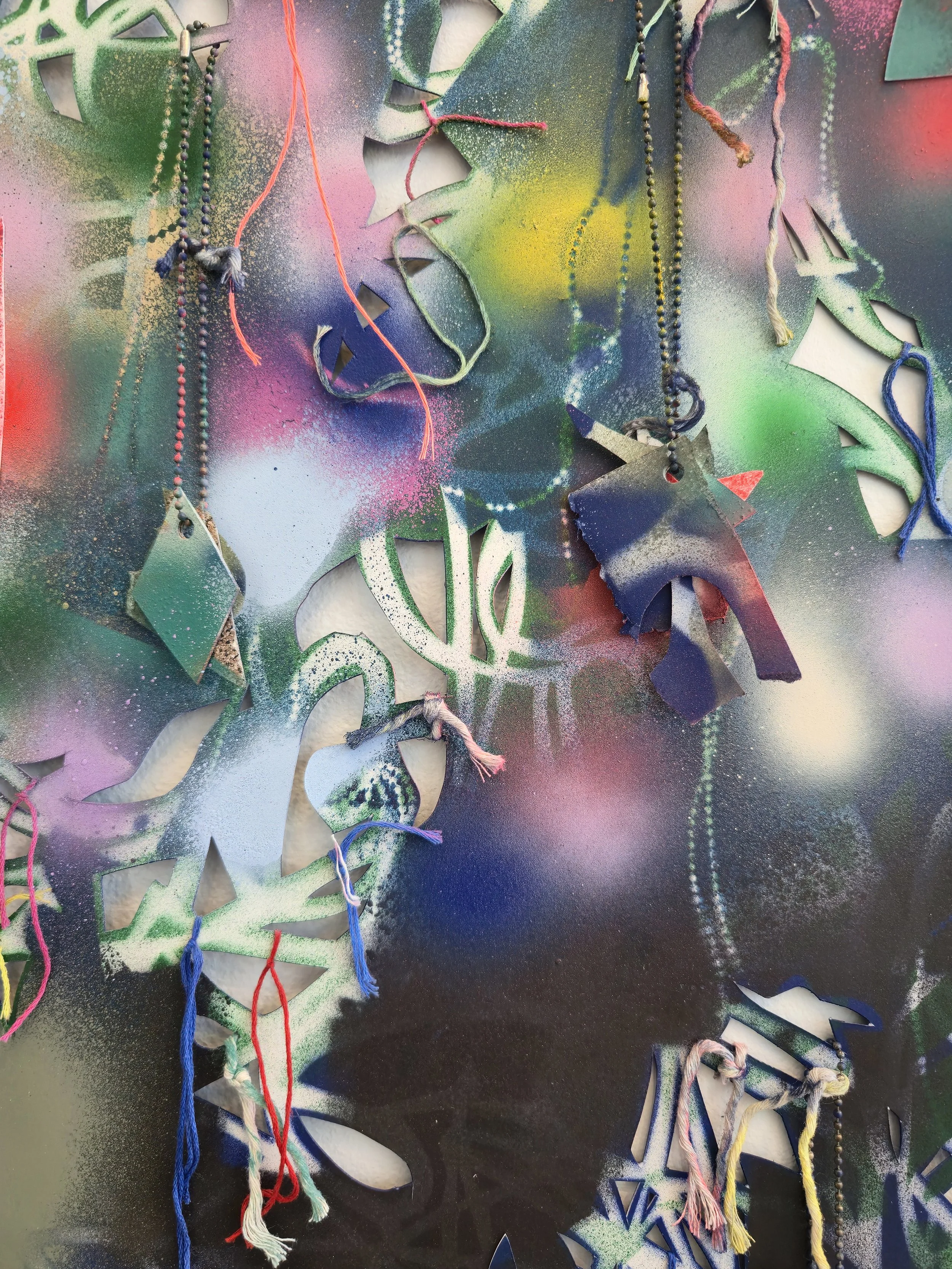   Parts &amp; Labor (2) , 2025, detail Spray paint, gouache, embroidery floss, painted string, ball chain, and found shells on hand cut and collaged paper 40 x 26 inches 