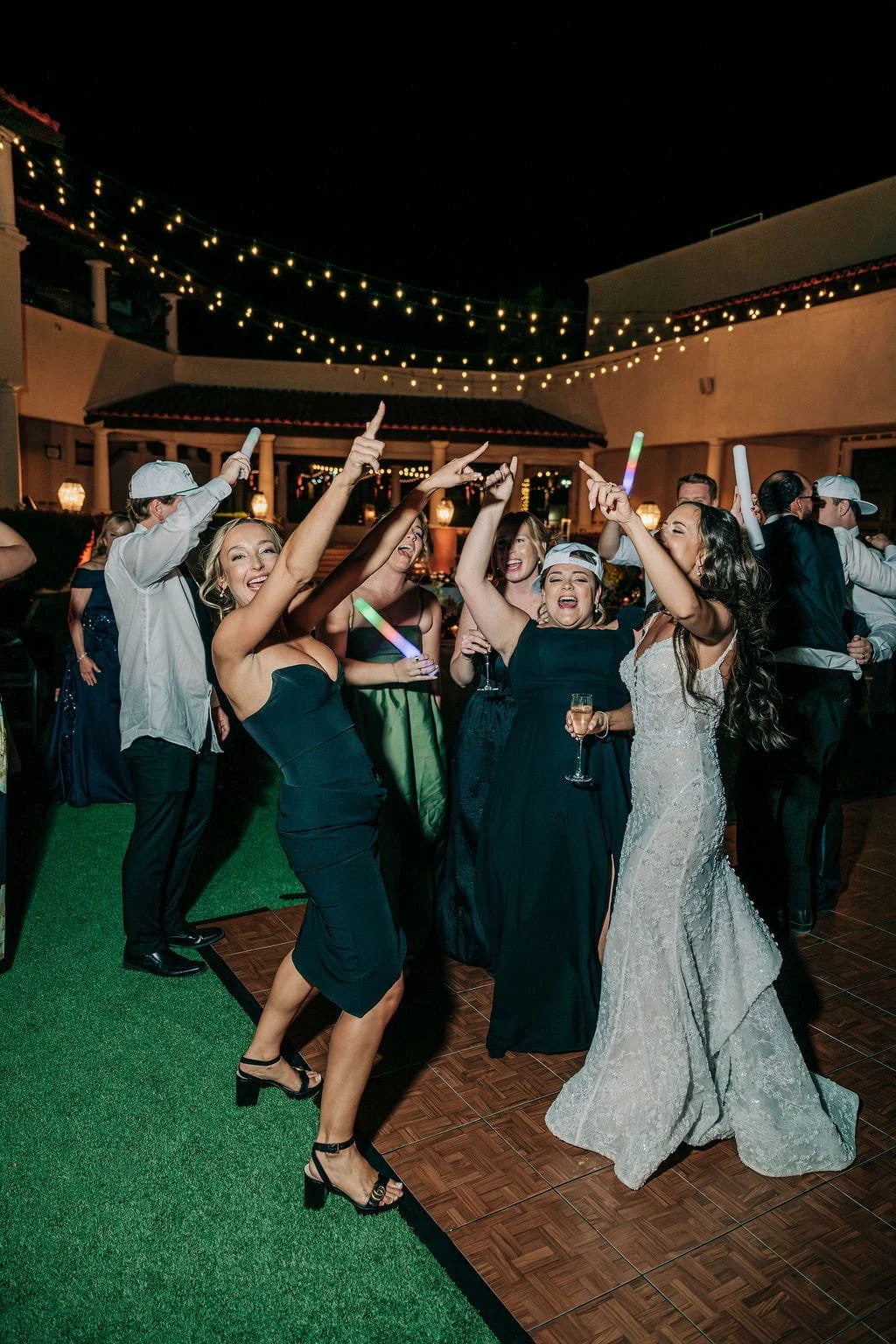 bride and guests celebrating on the dancefloor