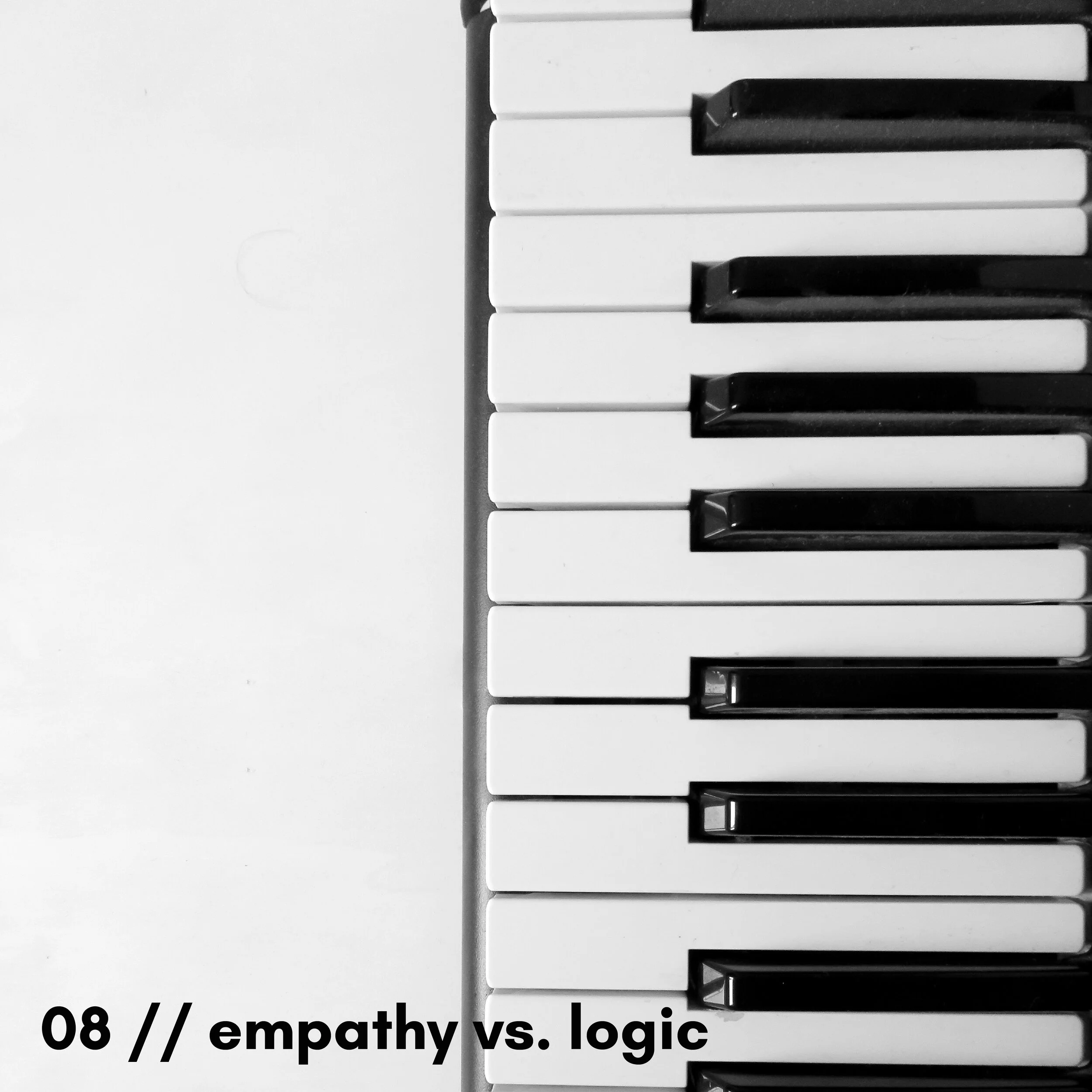 Close-up of piano keys, with some black and white keys visible, and partial text at the bottom reading "08// empathy vs. logic."