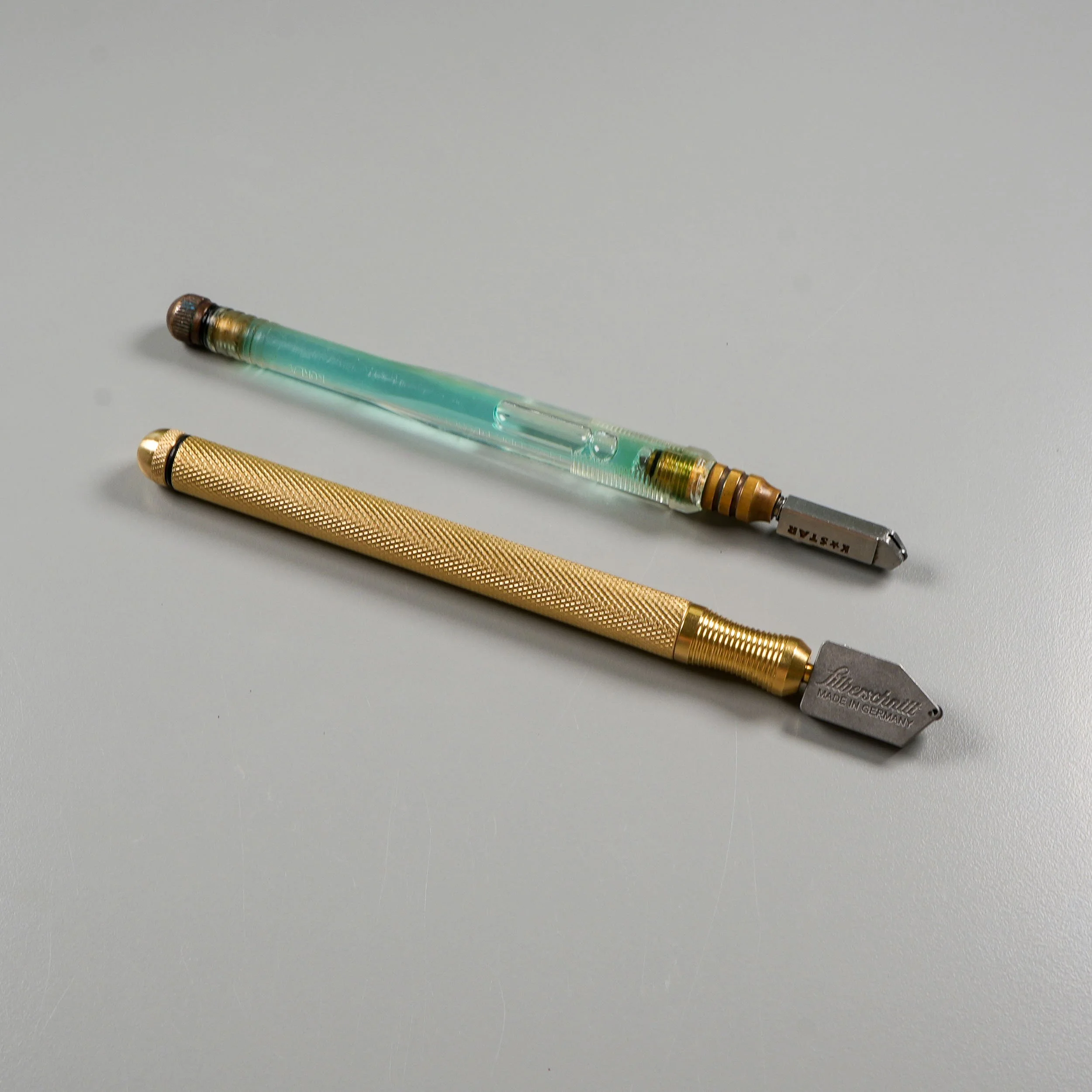 Two different brands of glass cutters