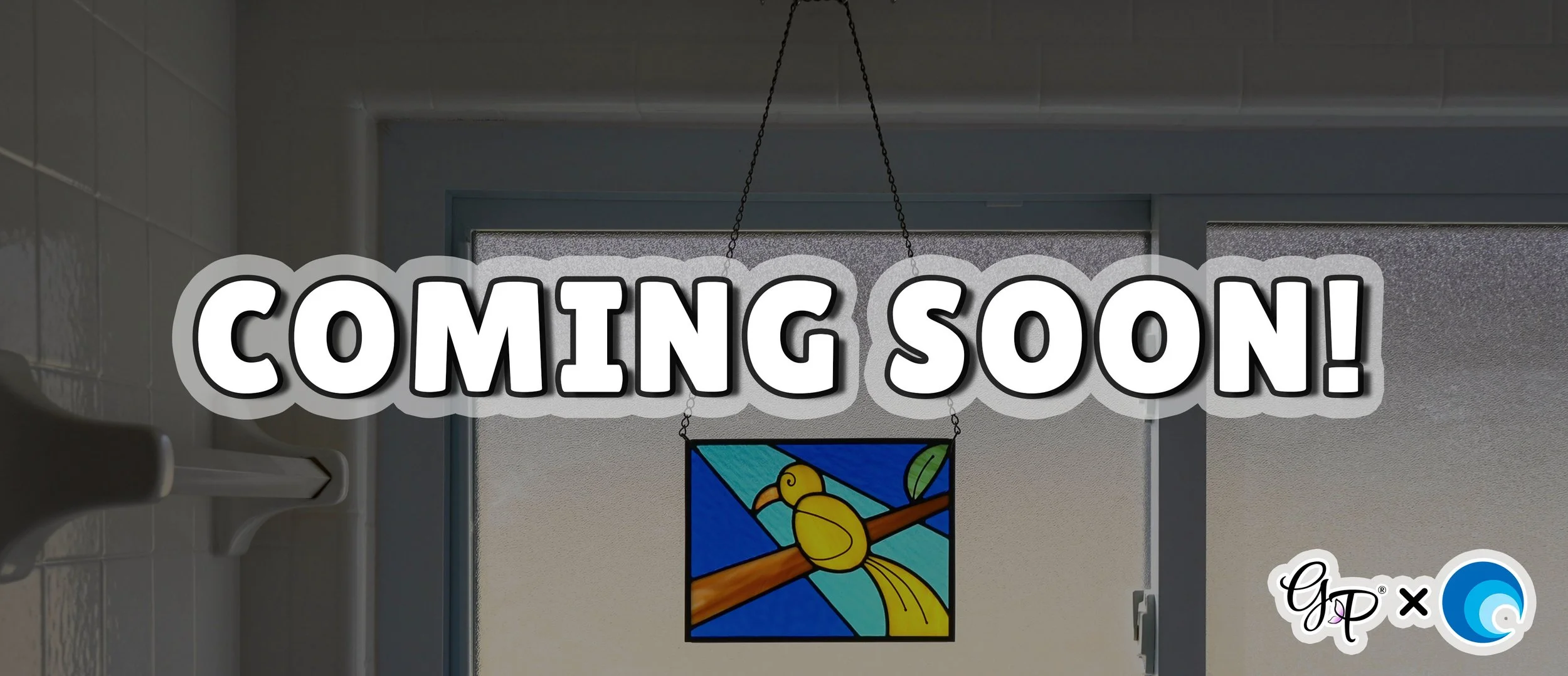 A stained glass canary panel hanging in a window