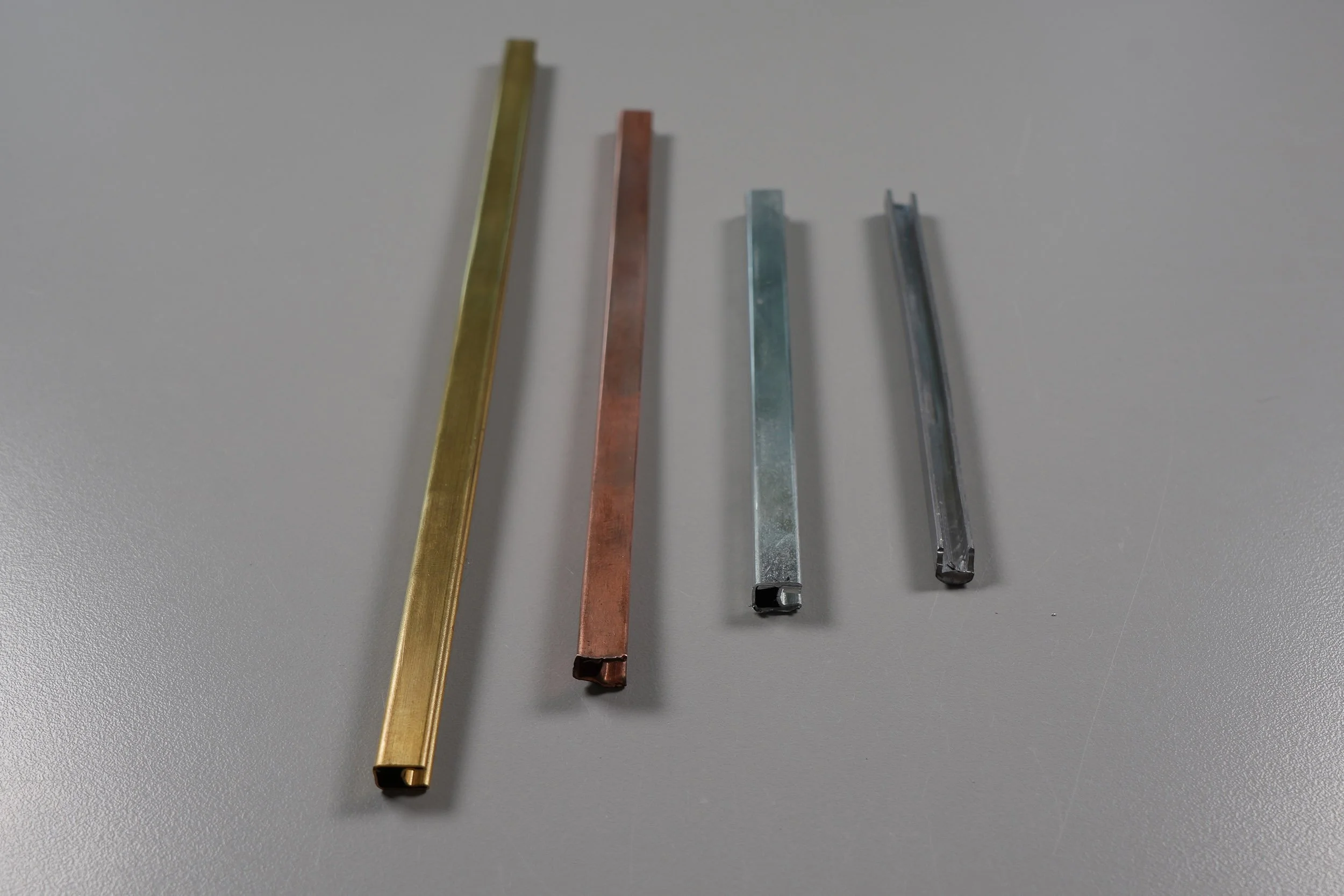 Segments of brass, copper, zinc, and lead came stained glass framing channels