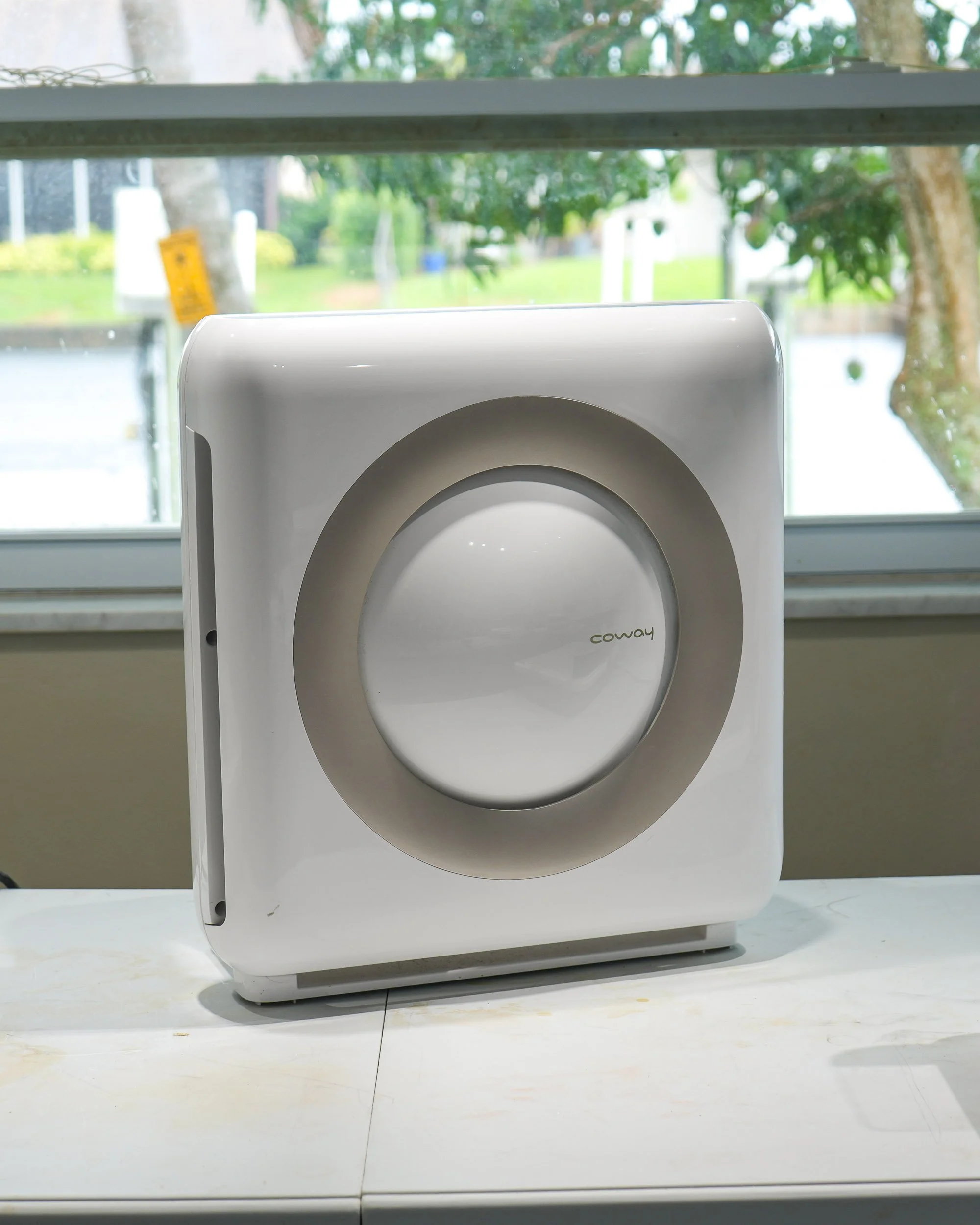 An air purifier with a HEPA filter within a stained glass home studio