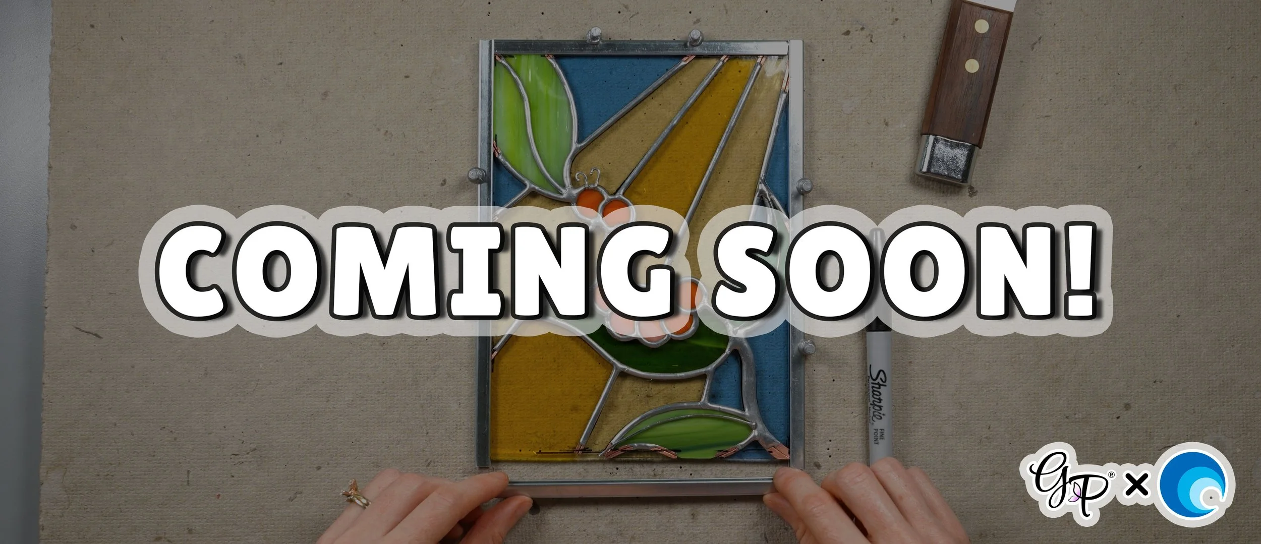 A stained glass project being framed with lead came
