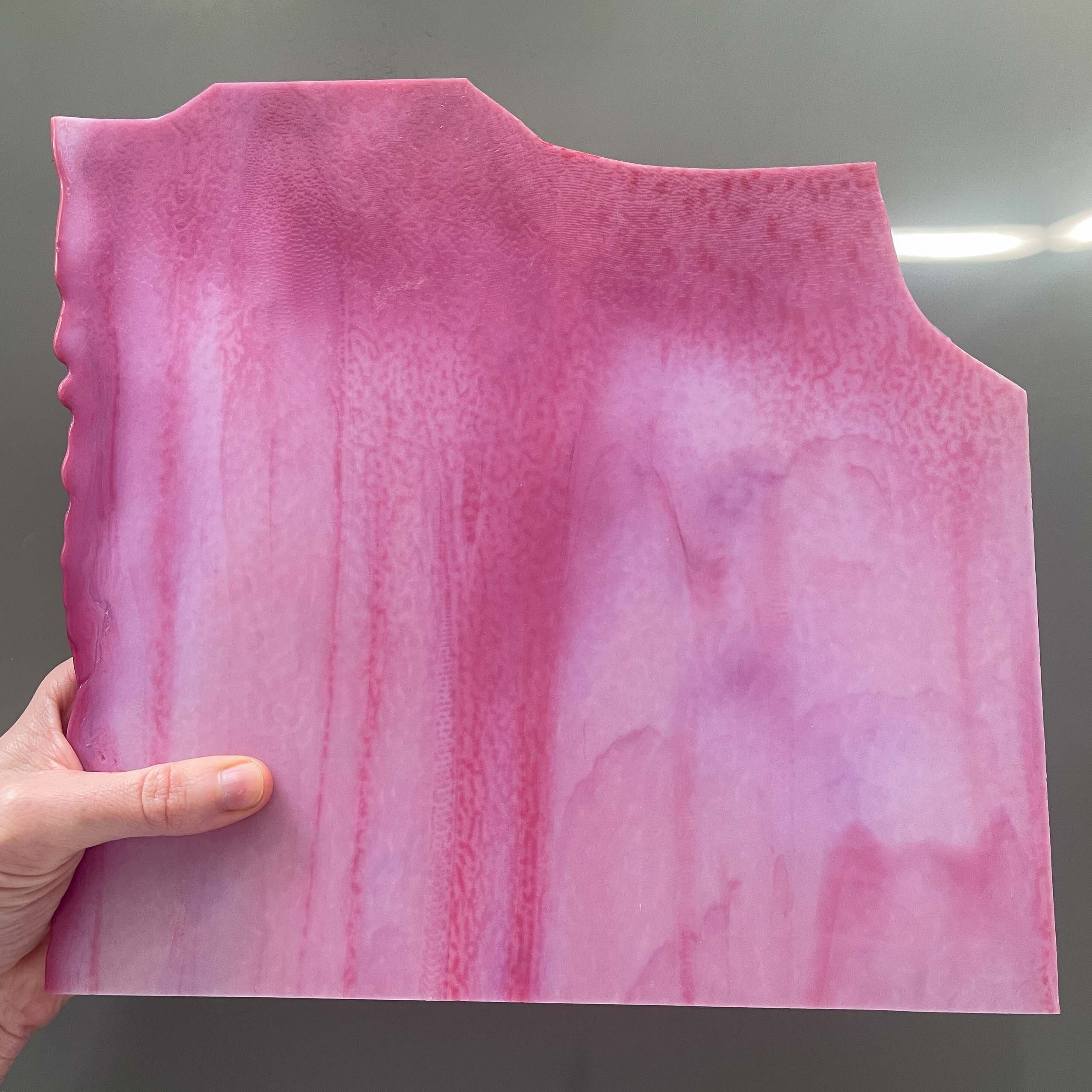 A pink sheet of stained glass, made with lead