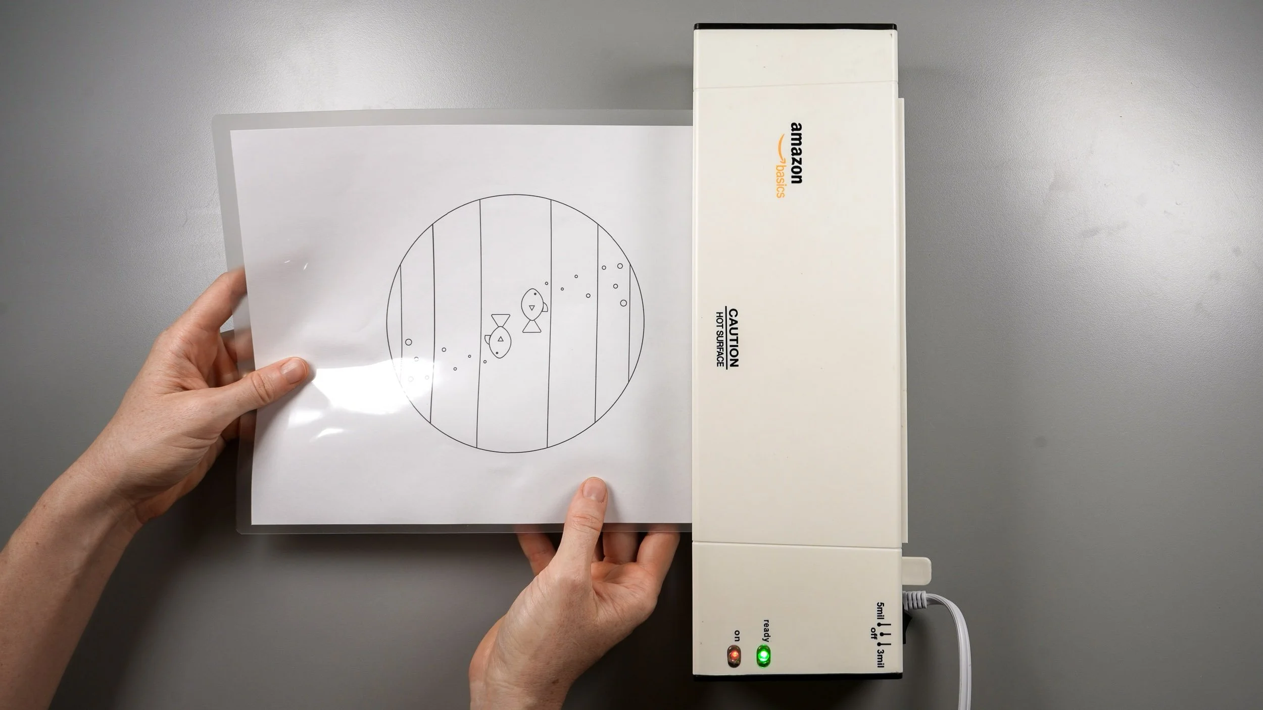 A fused glass pattern being laminated