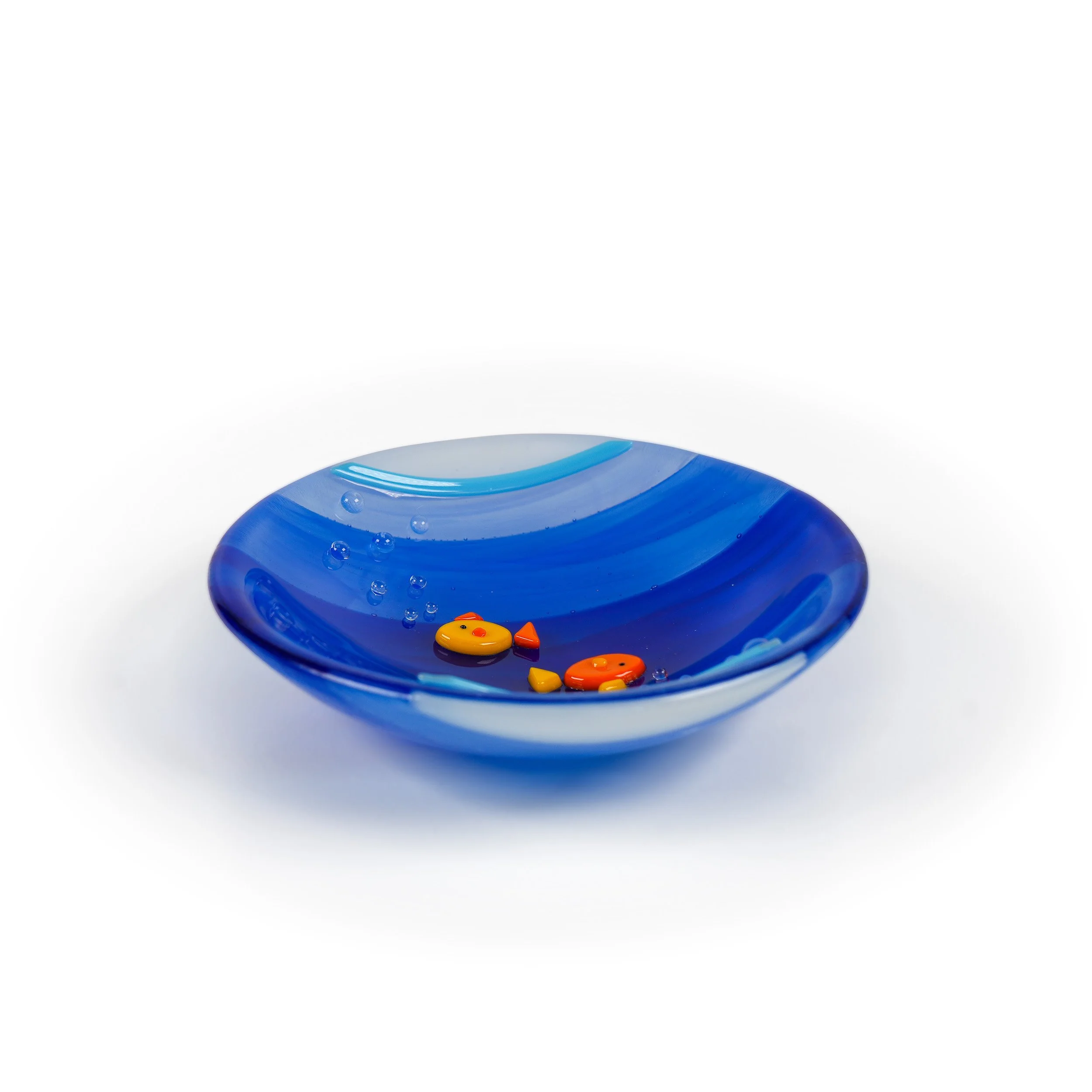 A fused glass 'Fish Bowl' dish, viewed on edge