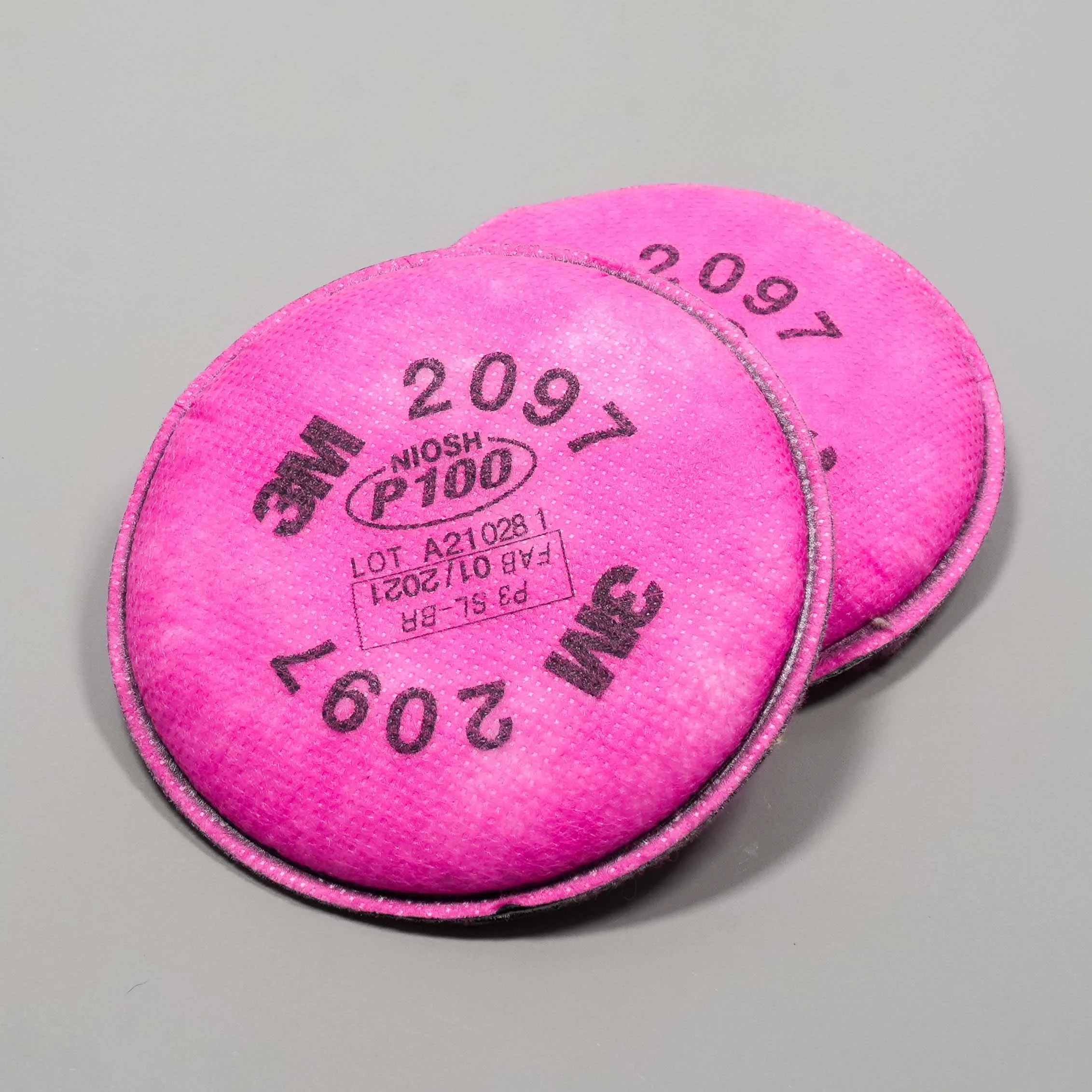 A pair of NIOSH-approved P100 respirator particulate filters