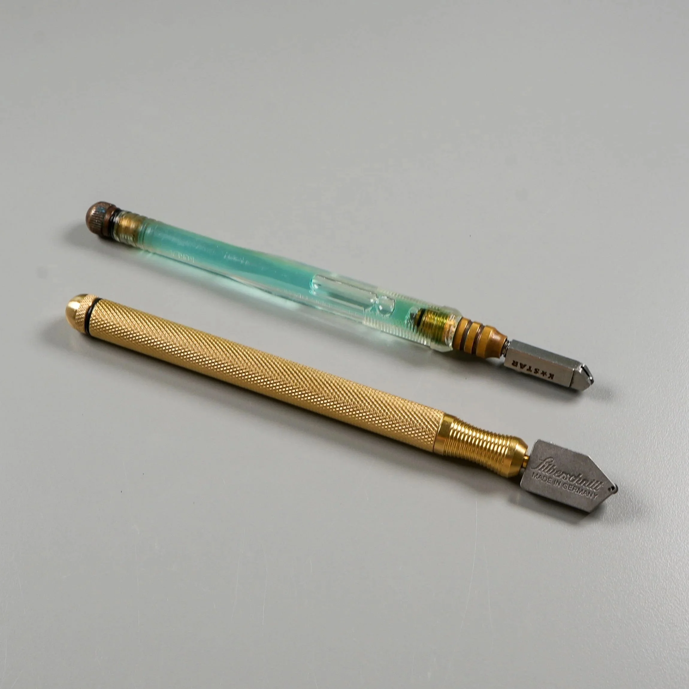 Two different brands of glass cutters