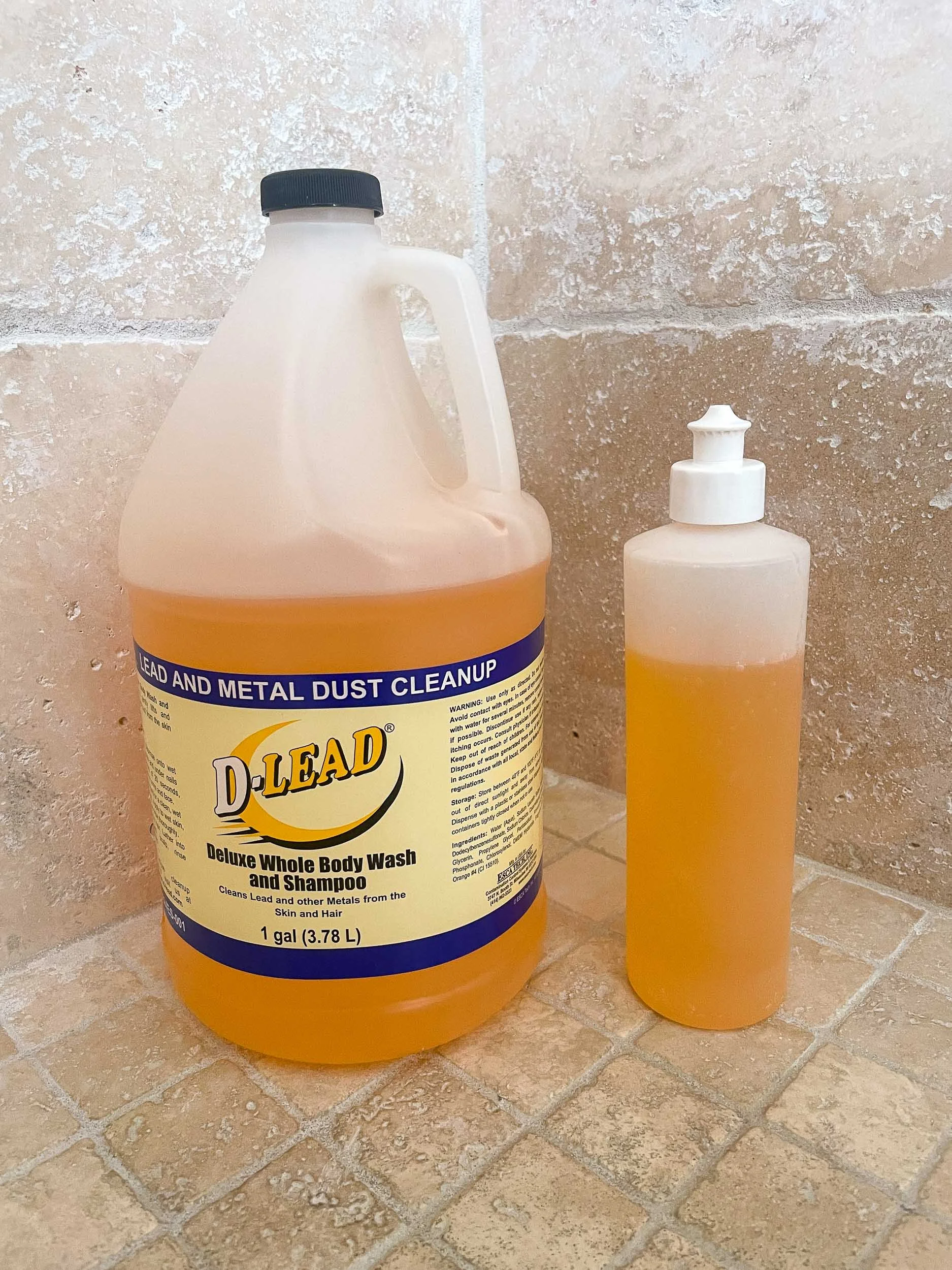 A gallon of de-leading body wash/shampoo in a shower
