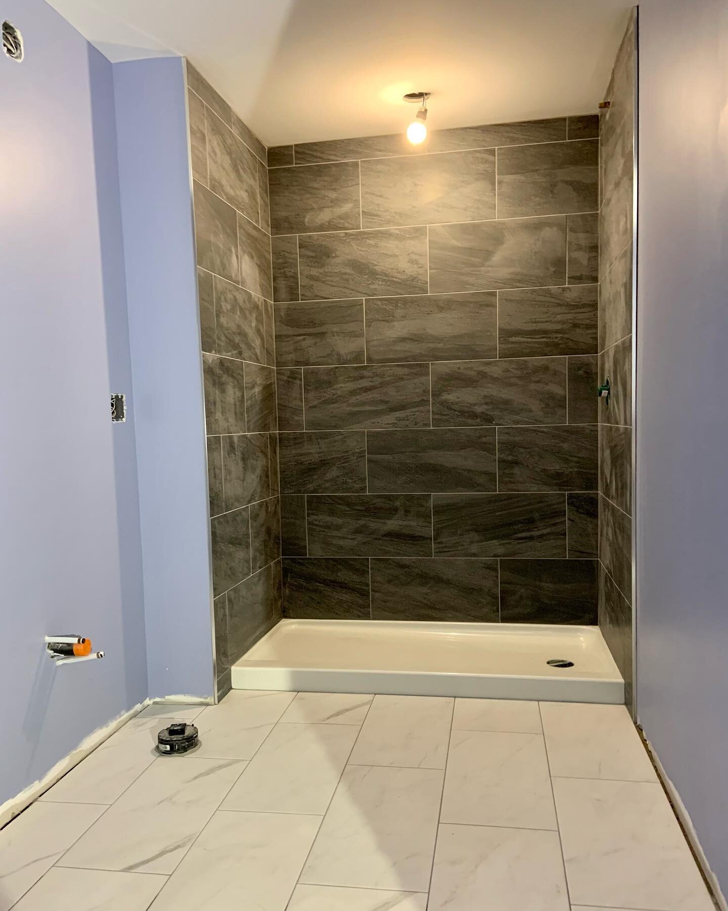A few shots of the tiling process! I am loving this dark wall tile!