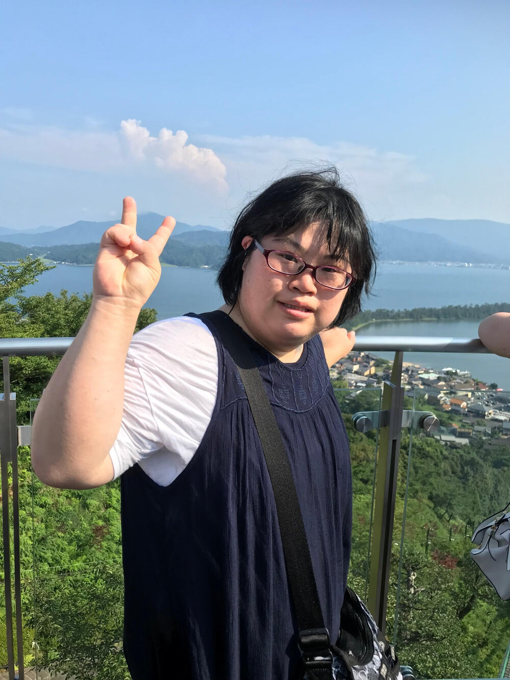 A picture of Haruka in front of a mountain view