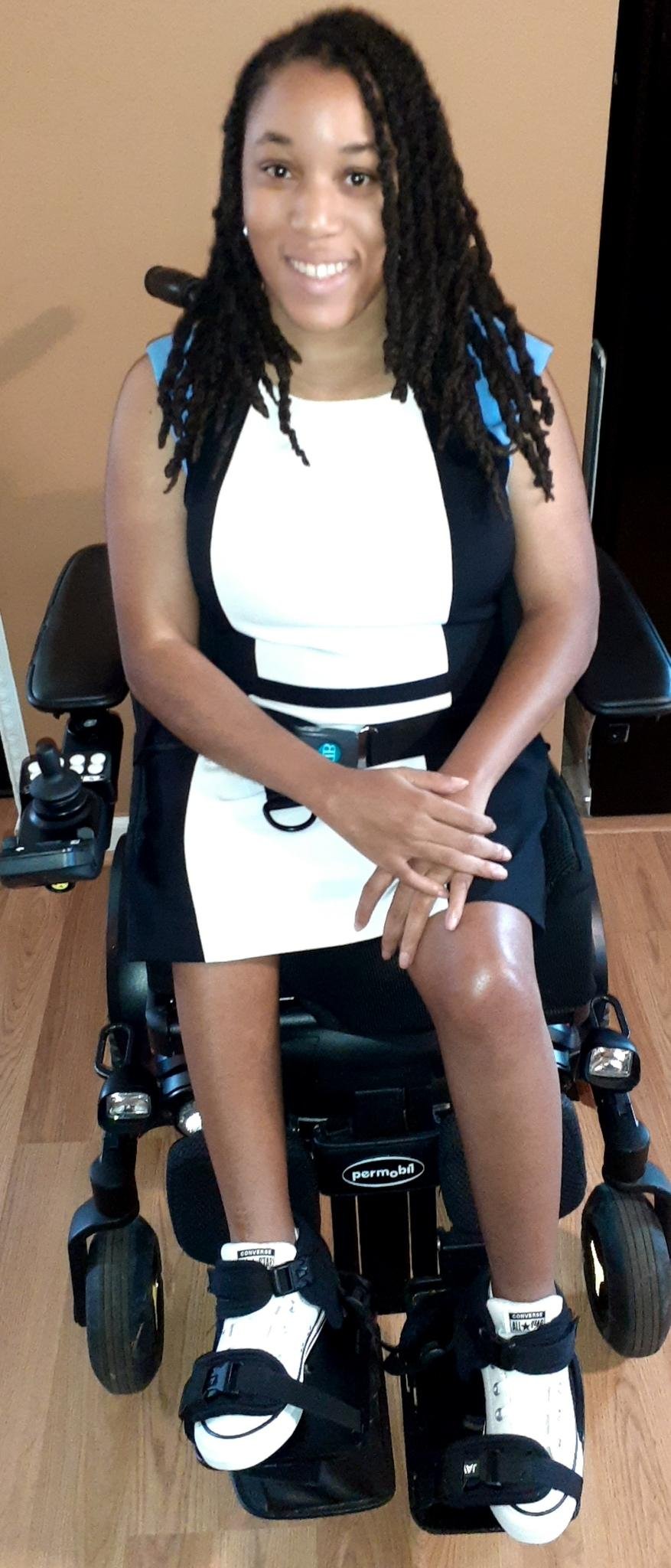  Jessica Johnson in a wheelchair, wearing a whitedress 