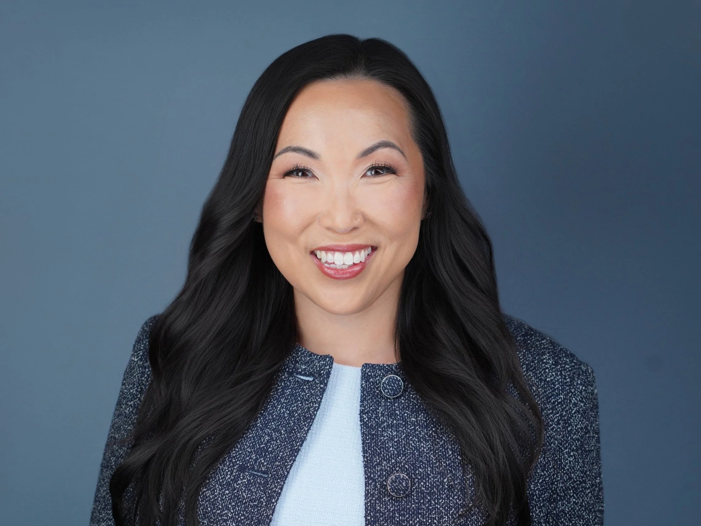 professional woman smiling blazer