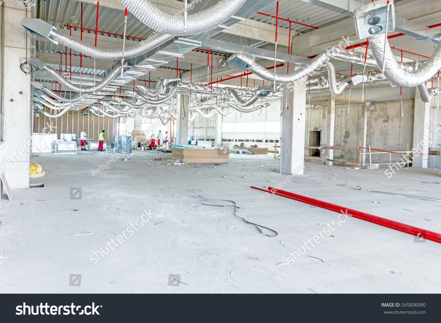 stock-photo-ventilation-pipes-in-silver-insulation-material-and-fire-sprinkler-on-red-pipe-are-hanging-from-the-545896990.jpg