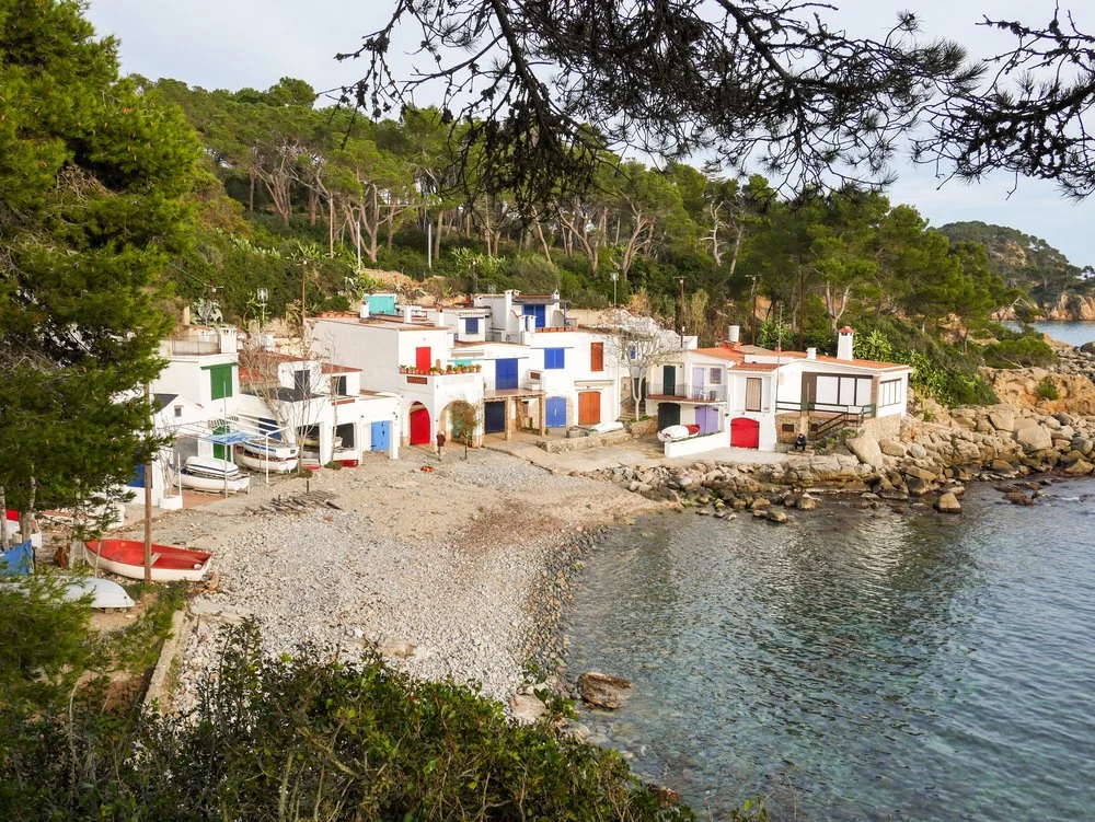Traditional Mediterranean fishing houses on the Costa Brava coastline, located near Nydum and the residential 500 Hour Yoga Teacher Training in Spain.