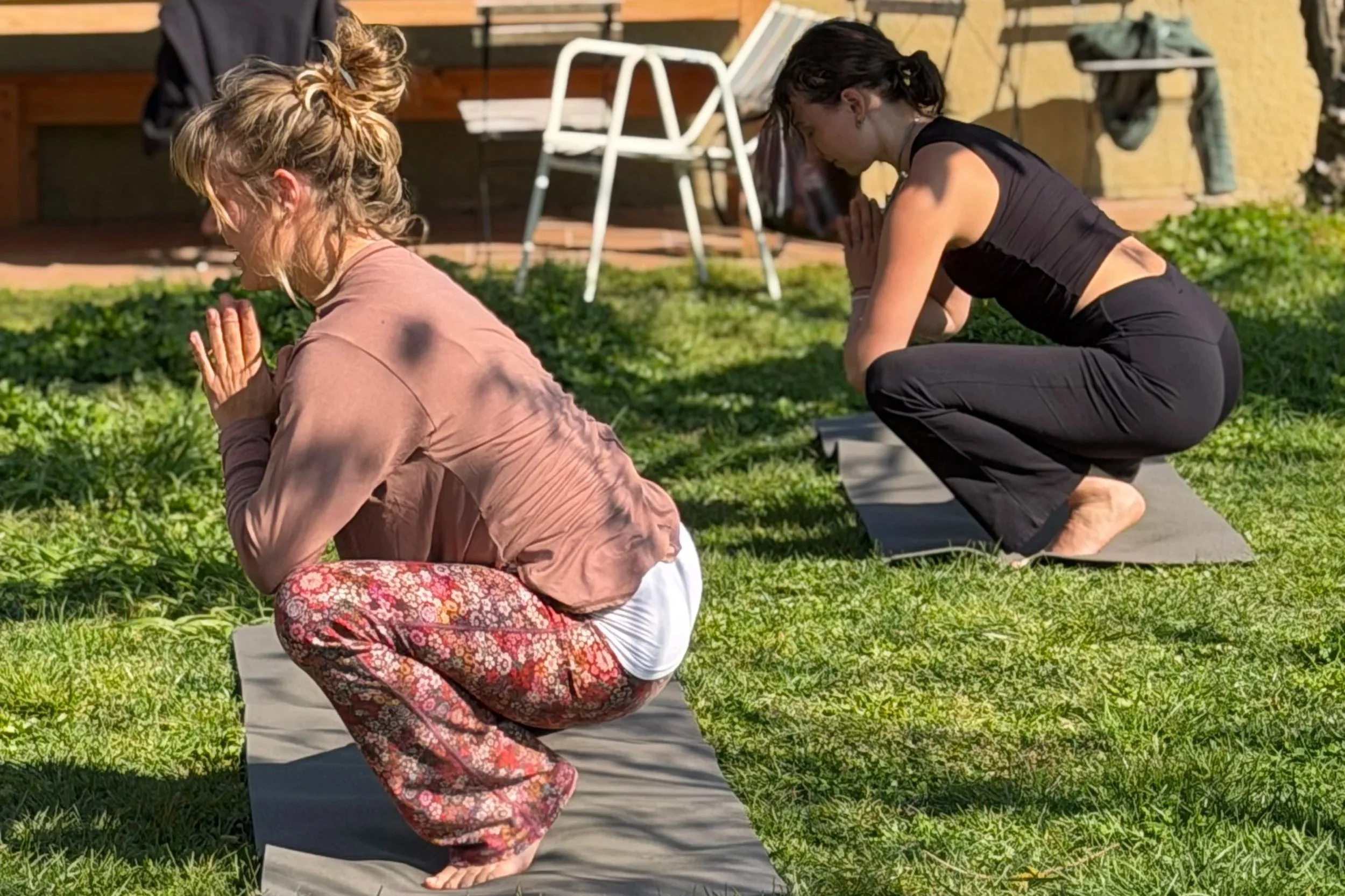 Outdoor group yoga practice during a residential Yoga Teacher Training in Spain.