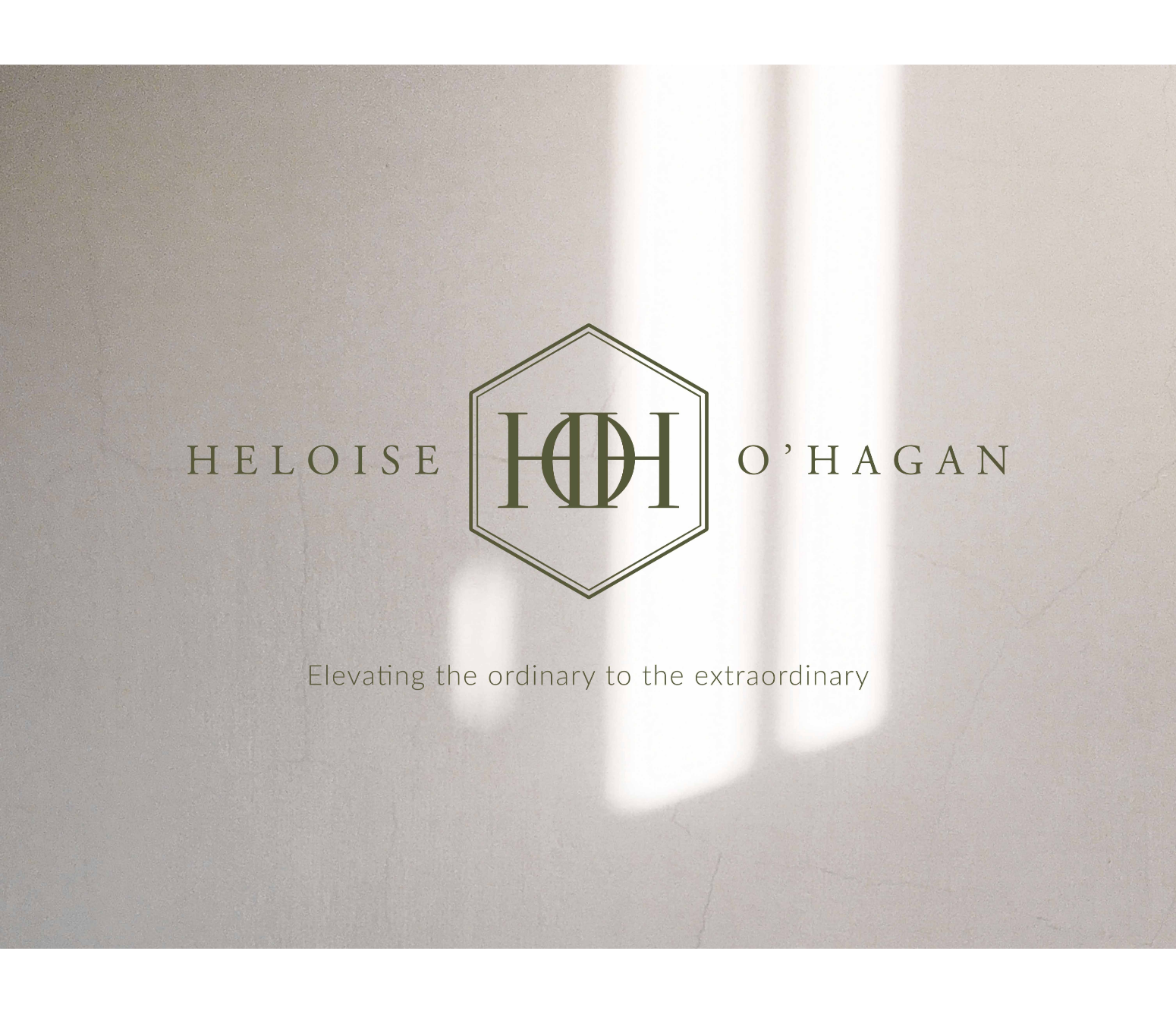 Brand logo for Heloise O'Hagan with the tagline 'Elevating the ordinary to the extraordinary' on a light beige background.