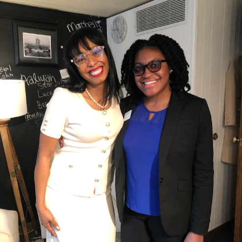  Brittany poses with a colleague. 