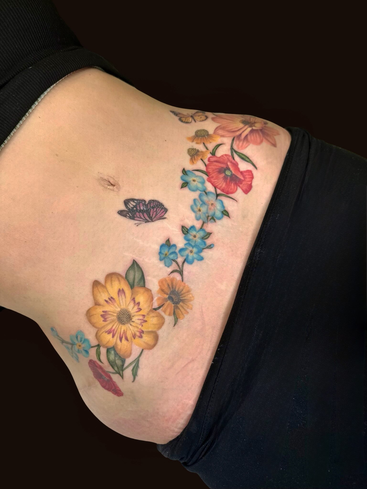 C section tattoo done by @amandamastattoo 🌷