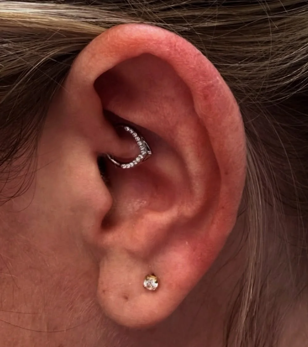 Piercing: Daith 

Jewelry: @invictus_bodyjewelry 
&bull;Titanium Pave Gem V-Shape Front Facing Hinged Segment Clicker&bull;