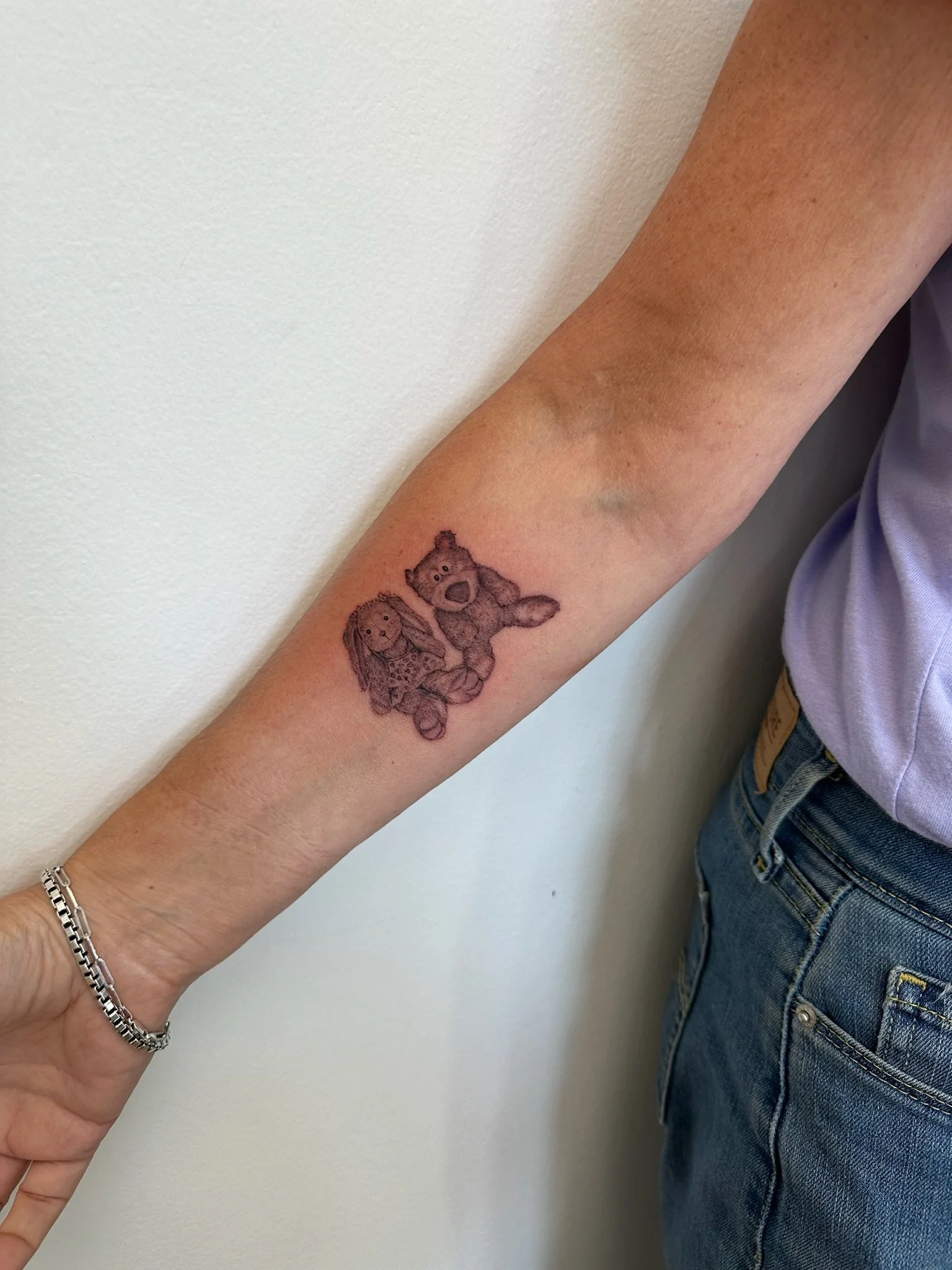 Tattoo of two stuffed animals 