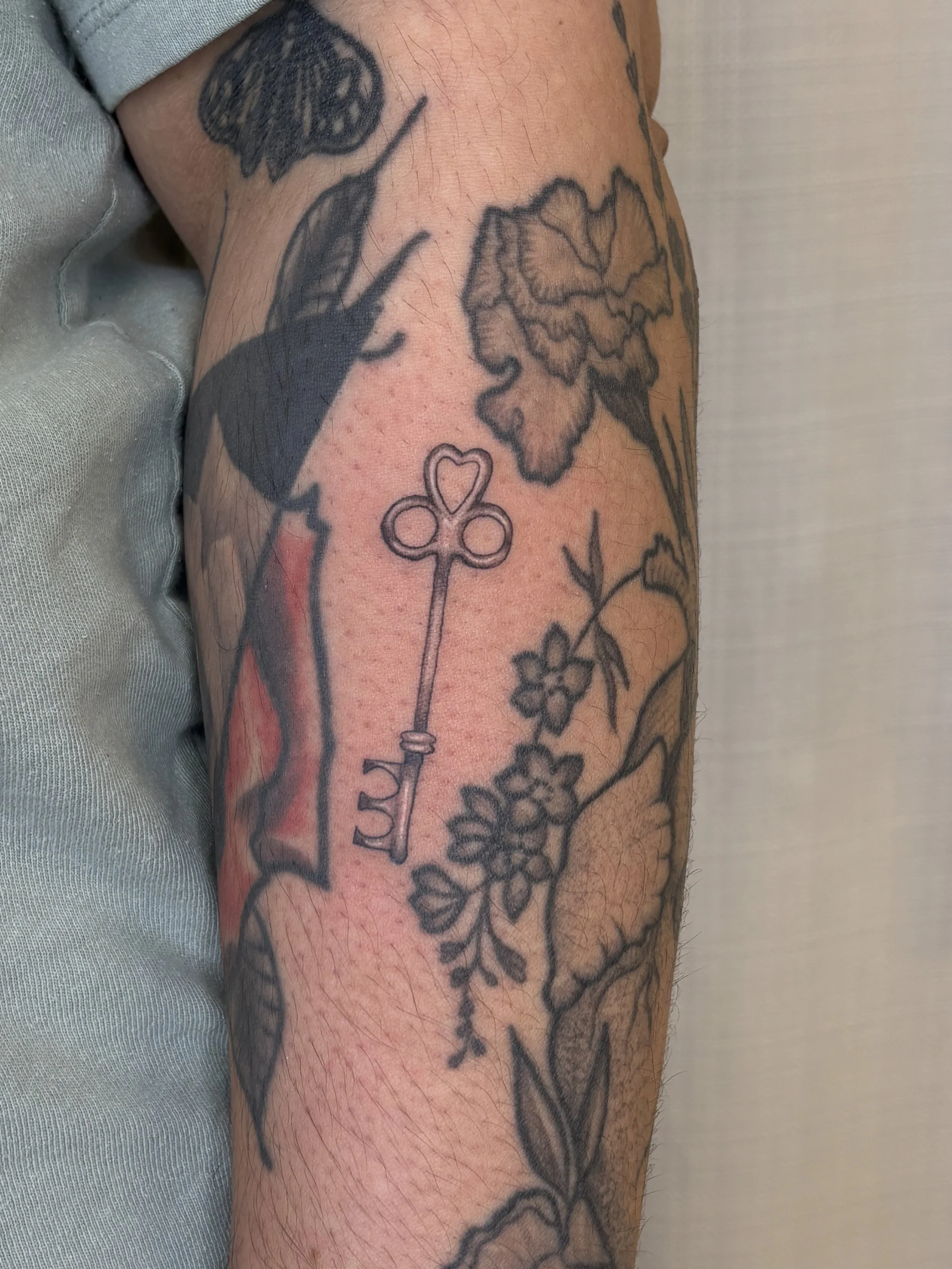 A tattoo of a key by Brooke Kalynn
