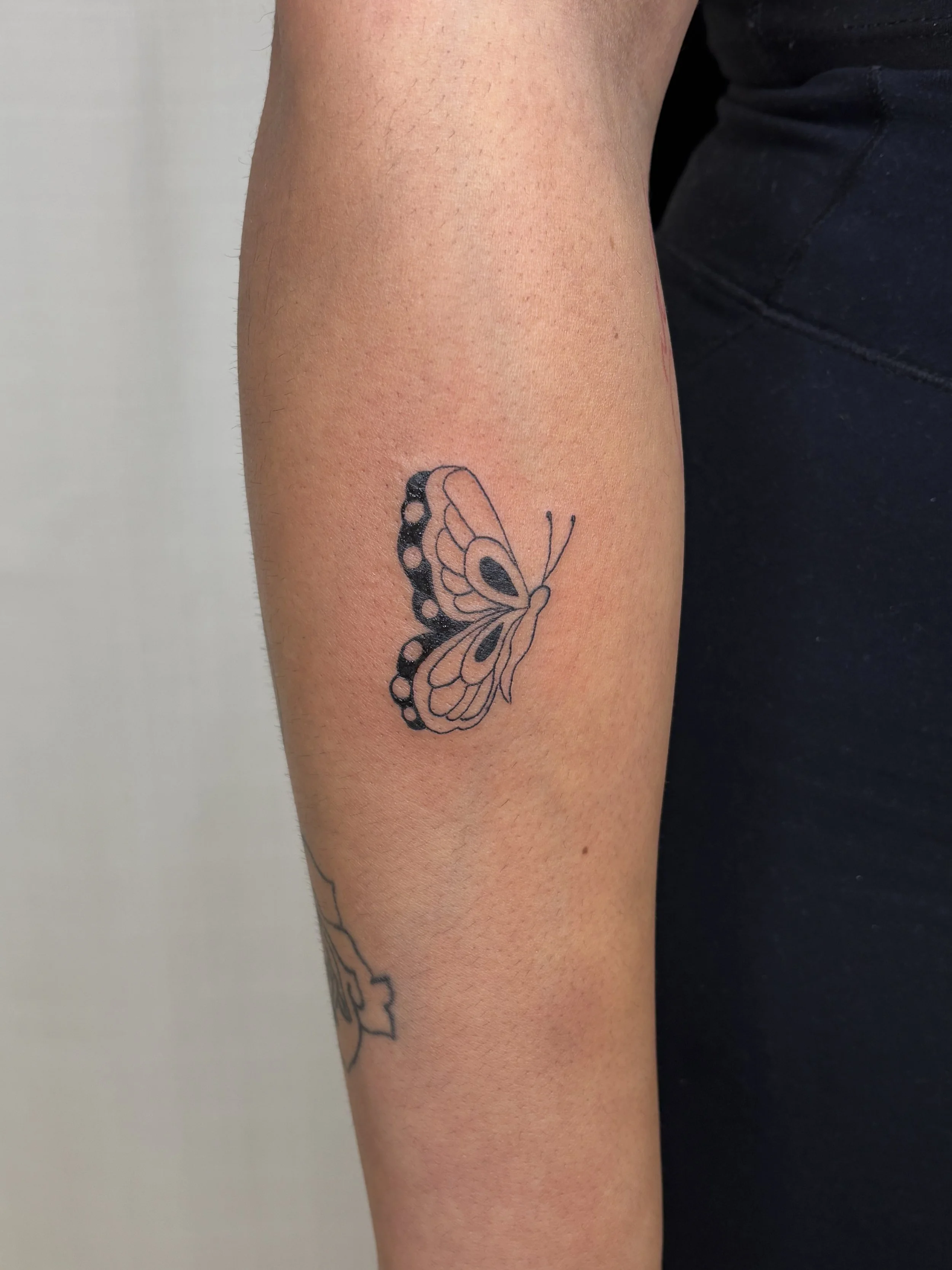 A tattoo of a butterfly