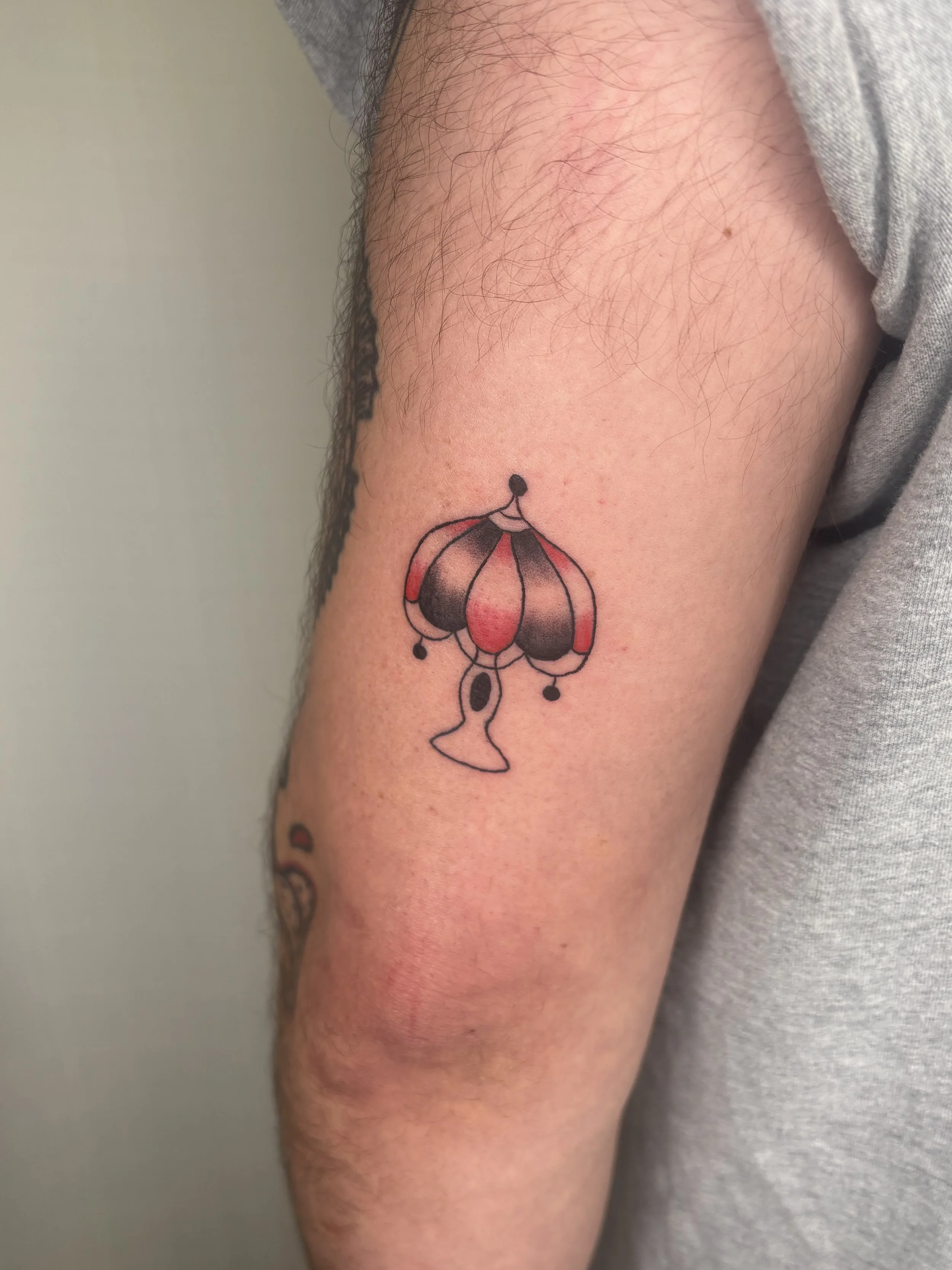 A tattoo of a lamp