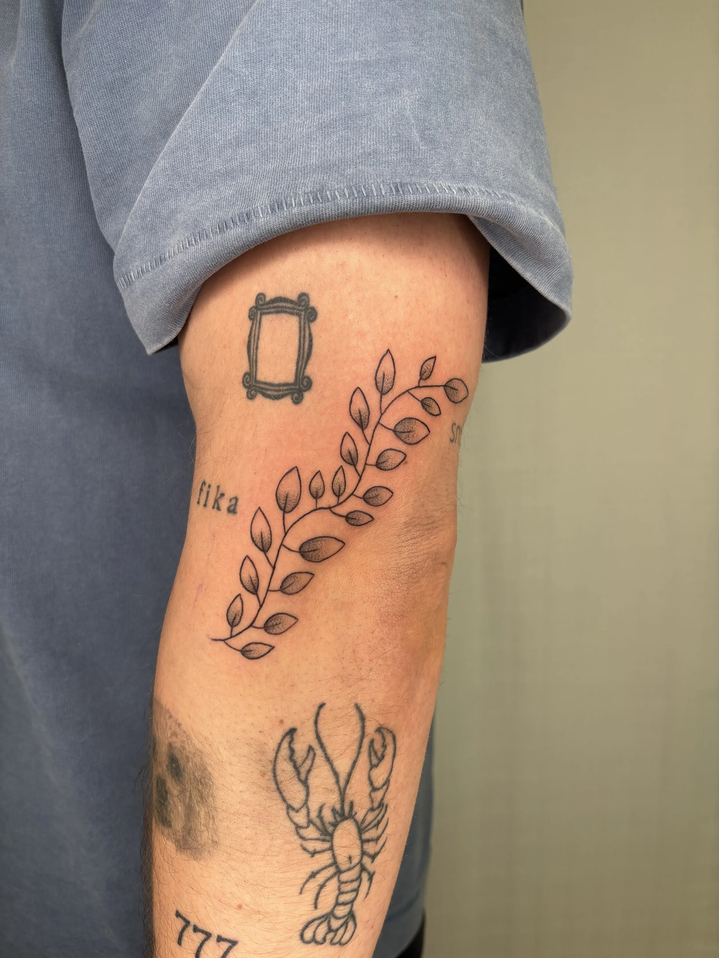 A tattoo of leaves