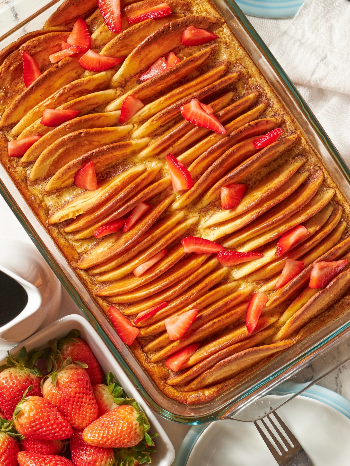 Spring recipes are in full swing in my kitchen (it will be 80 degrees this week 😭). While I do always wish for cooler weather, I&rsquo;m ready embrace the all the spring produce like the strawberries on top of this Pancake Casserole. Perfect for Mot