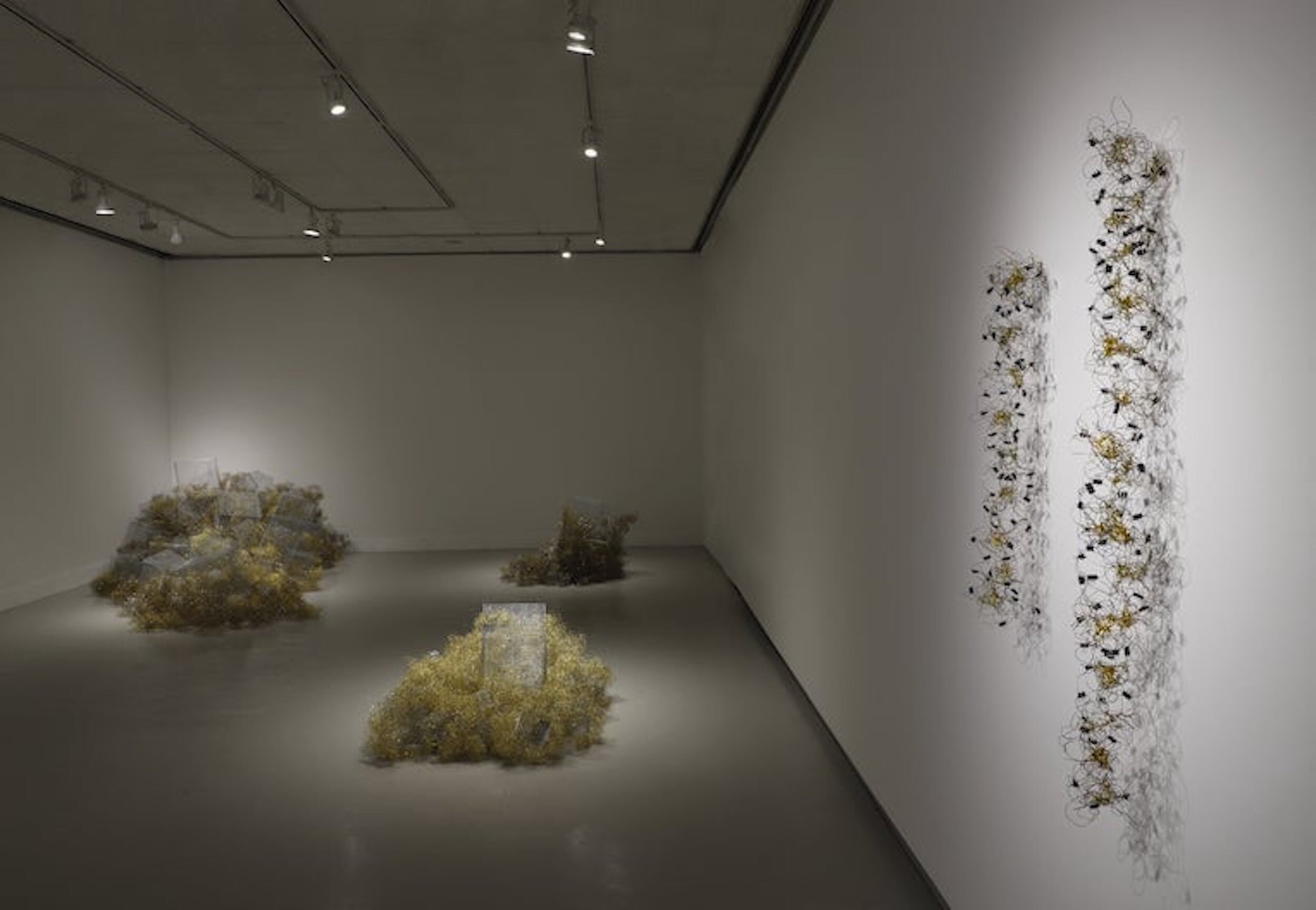 Gallery view with wall sculpture