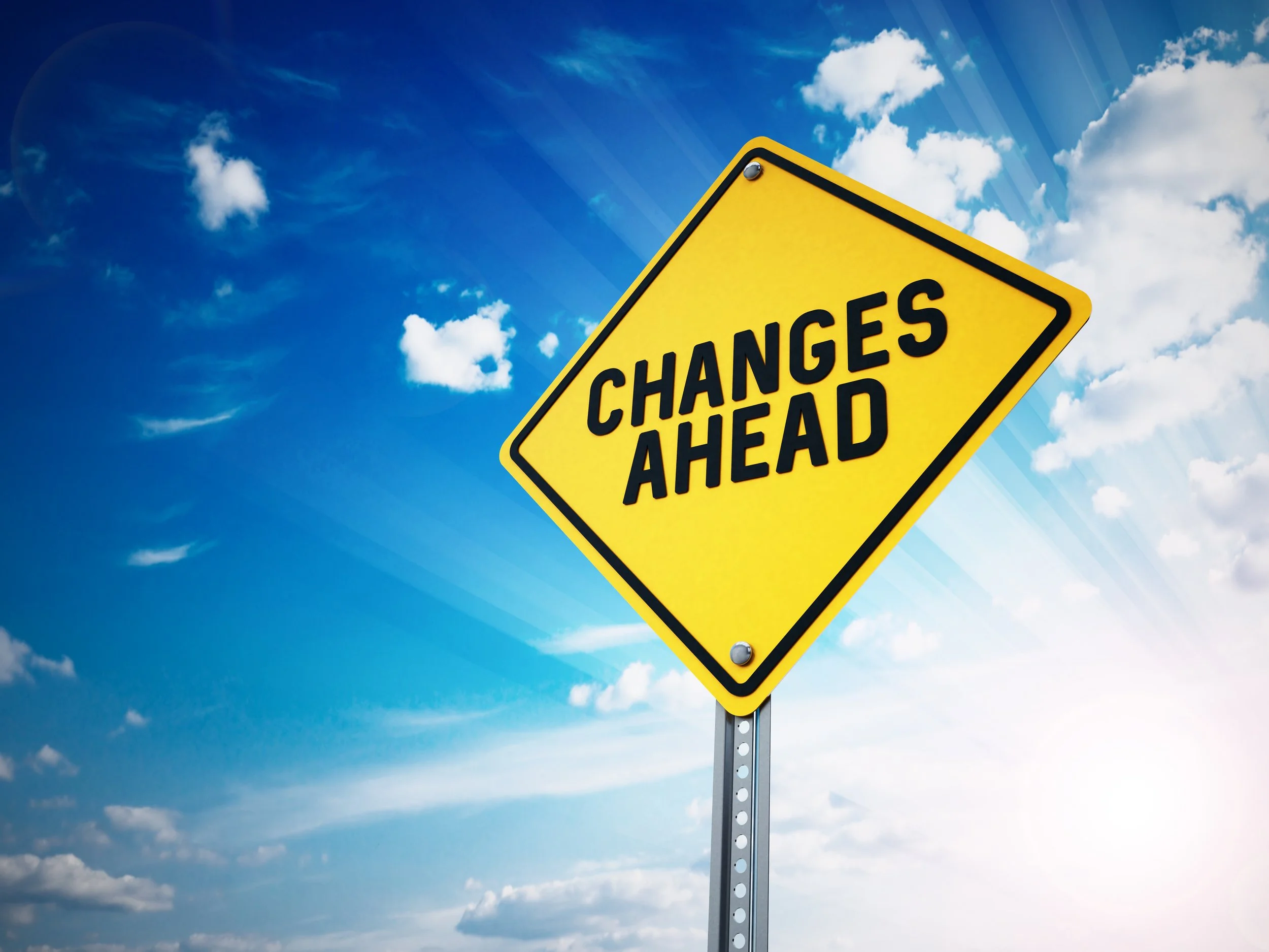 Yellow road sign that says "Changes Ahead"