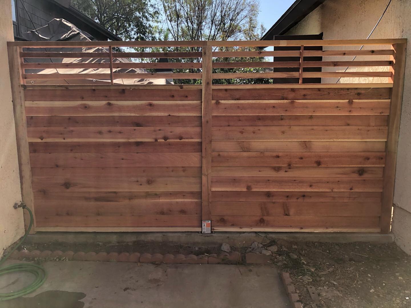 Another happy client. All Redwood 6&rsquo; high fence with a viewing window and stainless steel fasteners.