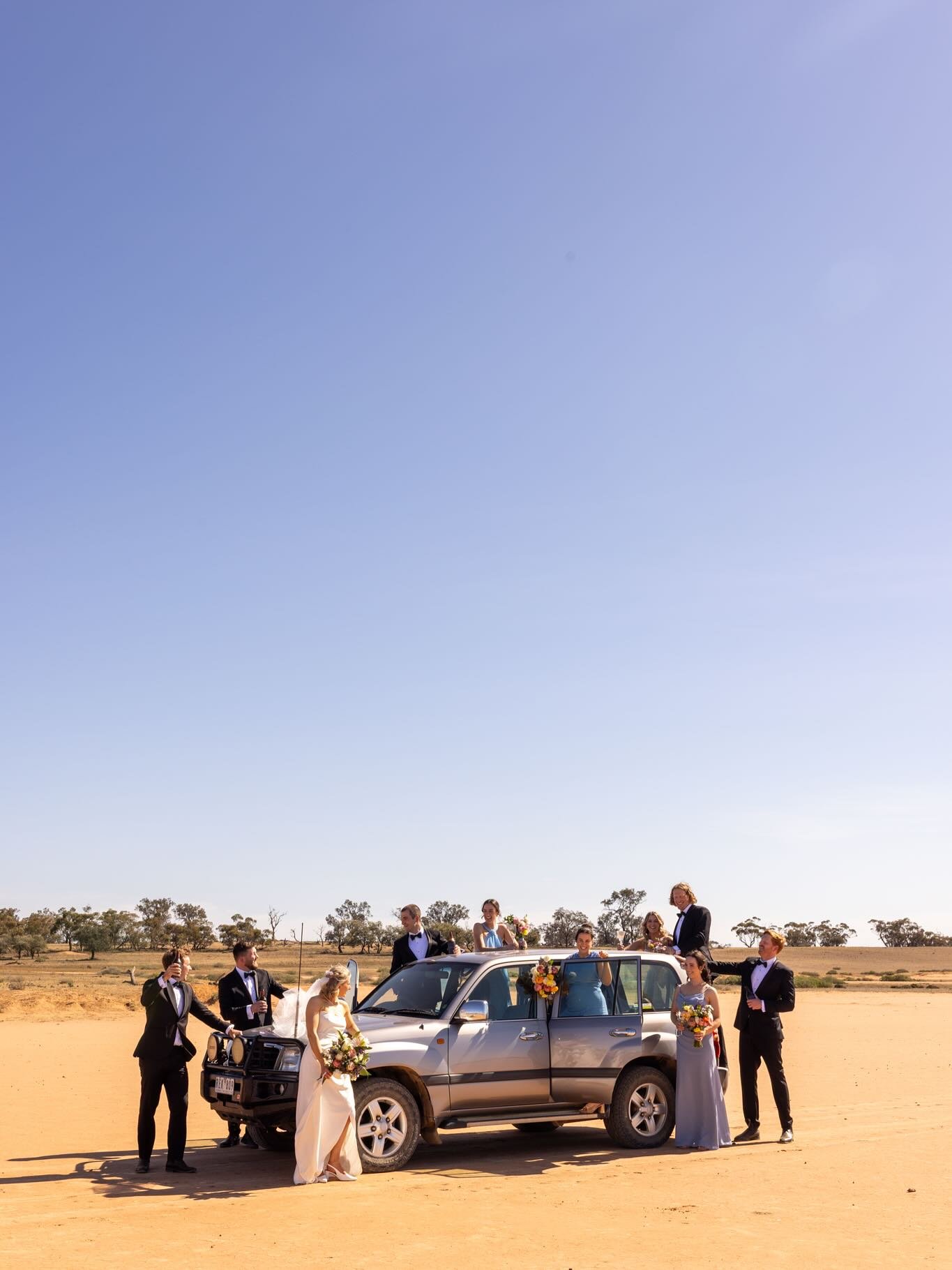 How wedding photos really roll out with Emma Jane Industry 🧡 Sure, we love a golden sunset or an intimate kiss, but we&rsquo;re also here for a Priscilla Queen of the Desert moment or a quick kick of the footy 🕺🏼