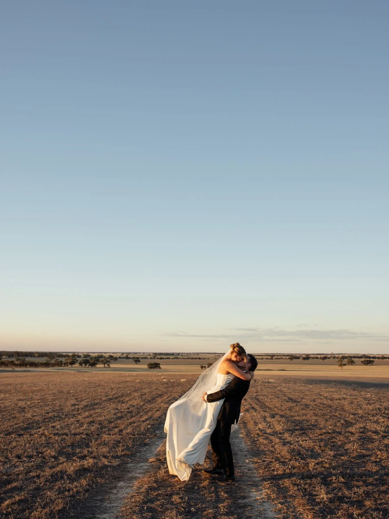 Imagine marrying your best friend in the very place you proposed as the sun sets around you. Then, on your wedding day, returning to that exact spot to relive it all over again. That very spot is your own farm and home filled with golden skies and fu