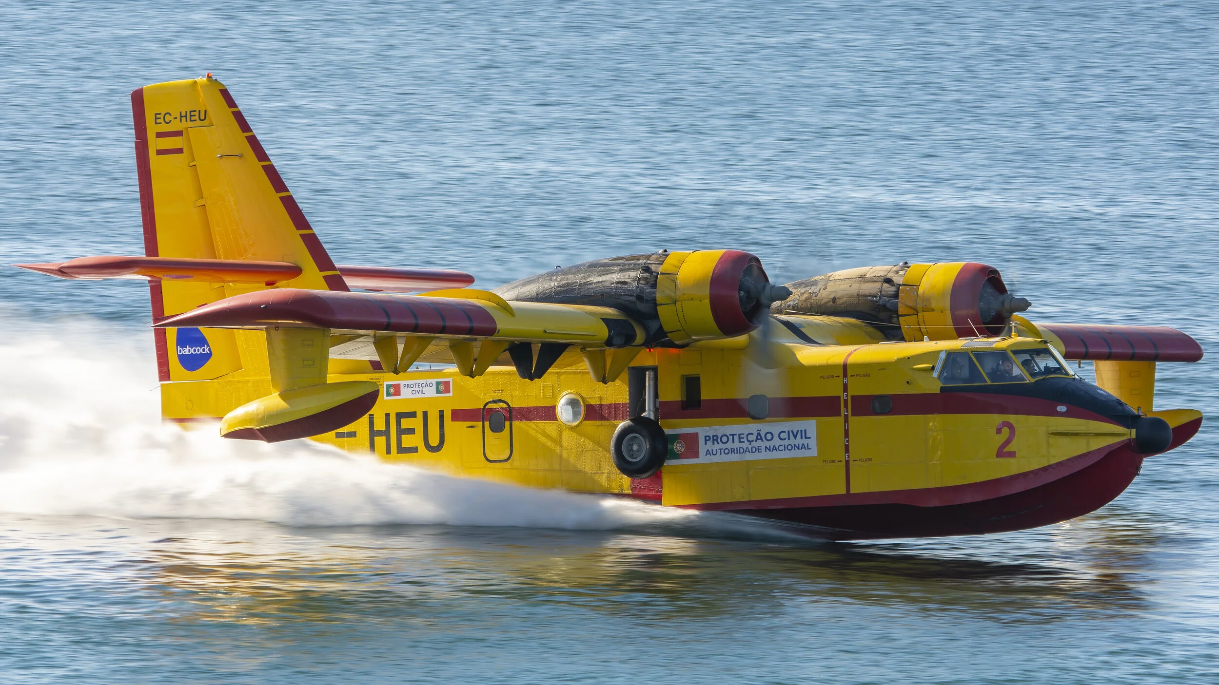 Cascais, Portugal. EC-HEU Canadair CL-215 CEGISA filling up to fight fire in Serra de Sintra