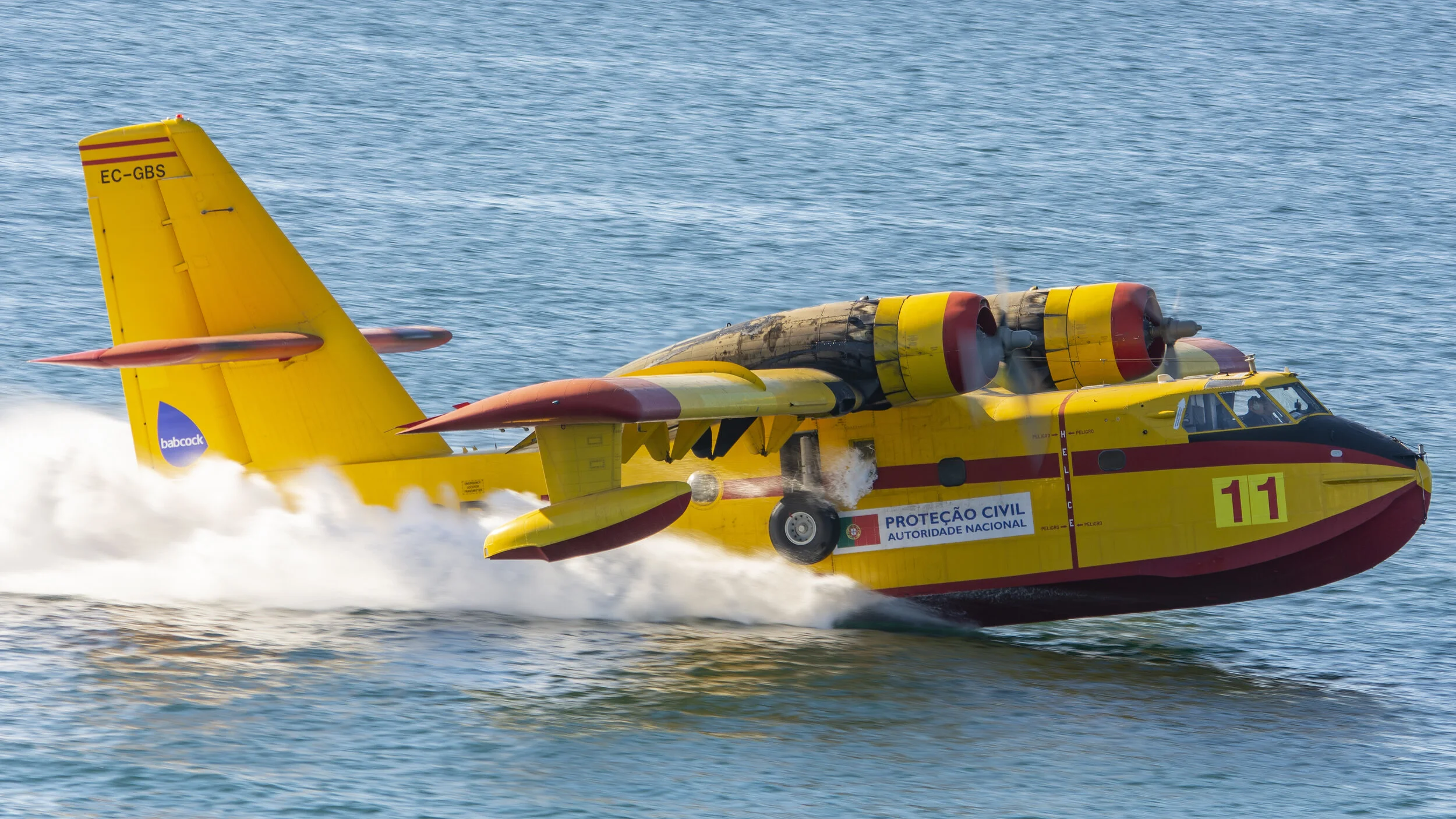 Cascais, Portugal. EC-GBS Canadair CL-215 CEGISA filling up to fight fire in Serra de Sintra