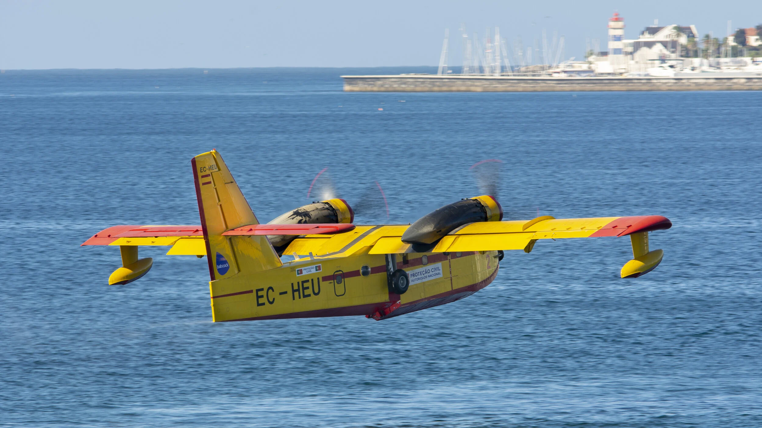 Cascais, Portugal. EC-HEU Canadair CL-215 CEGISA filling up to fight fire in Serra de Sintra