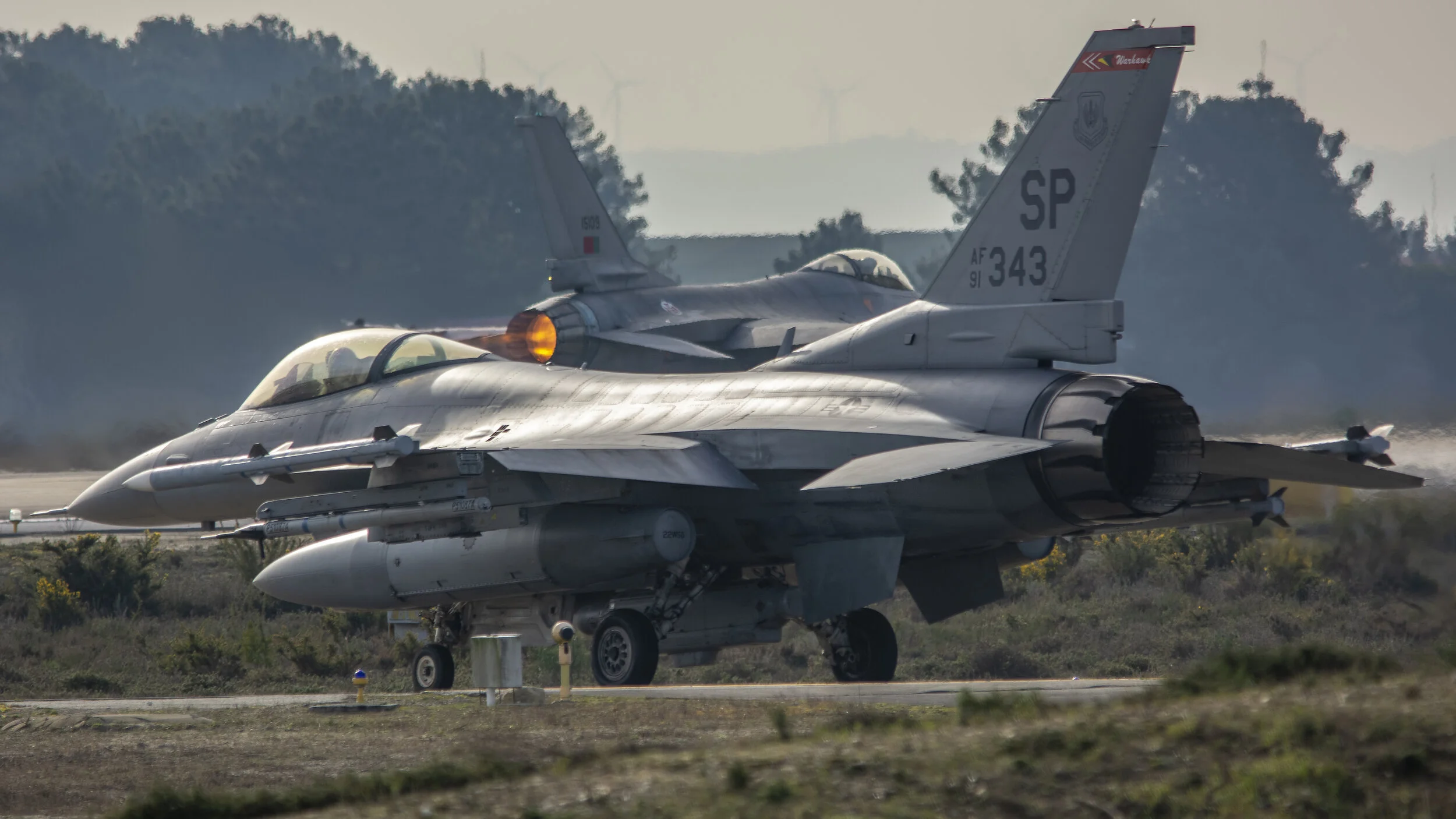 FAP BA5 Monte Real, Portugal. USAF F16s - Joint Exercise. USAF 91-0343 52nd FW Spangdahlem AB, Germany General Dynamics F-16C Fighting Falcon Holding with FAP 15109 General Dynamics F-16MLU Fighting Falcon Burning down the runway!