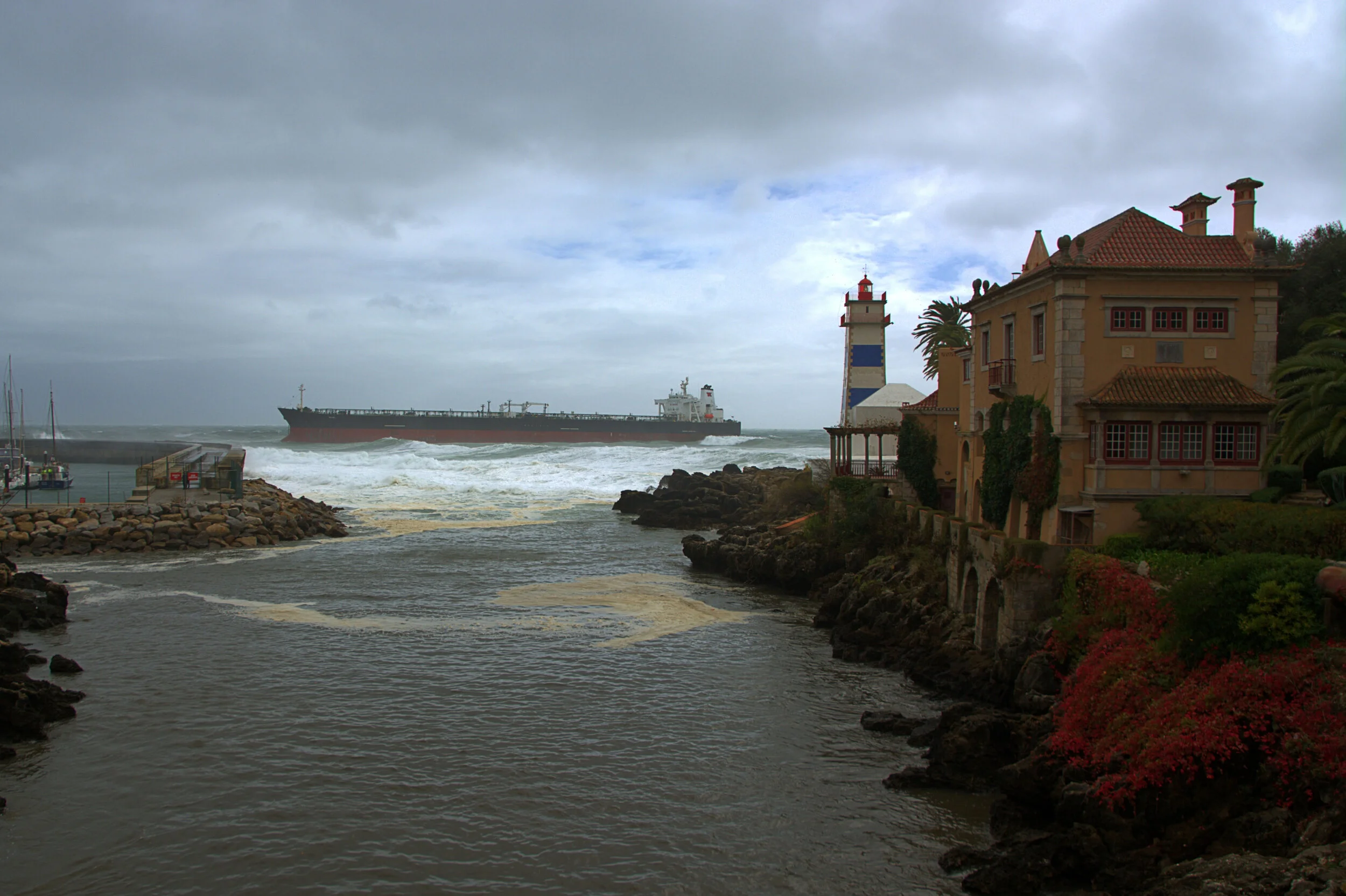 Cascais Bay, Portugal. Oct 2015.
Bahamas-flagged crude oil tanker owned by Teekay Tankers grounded in stormy weather  just outside the breakwater at the Cascais marina. 